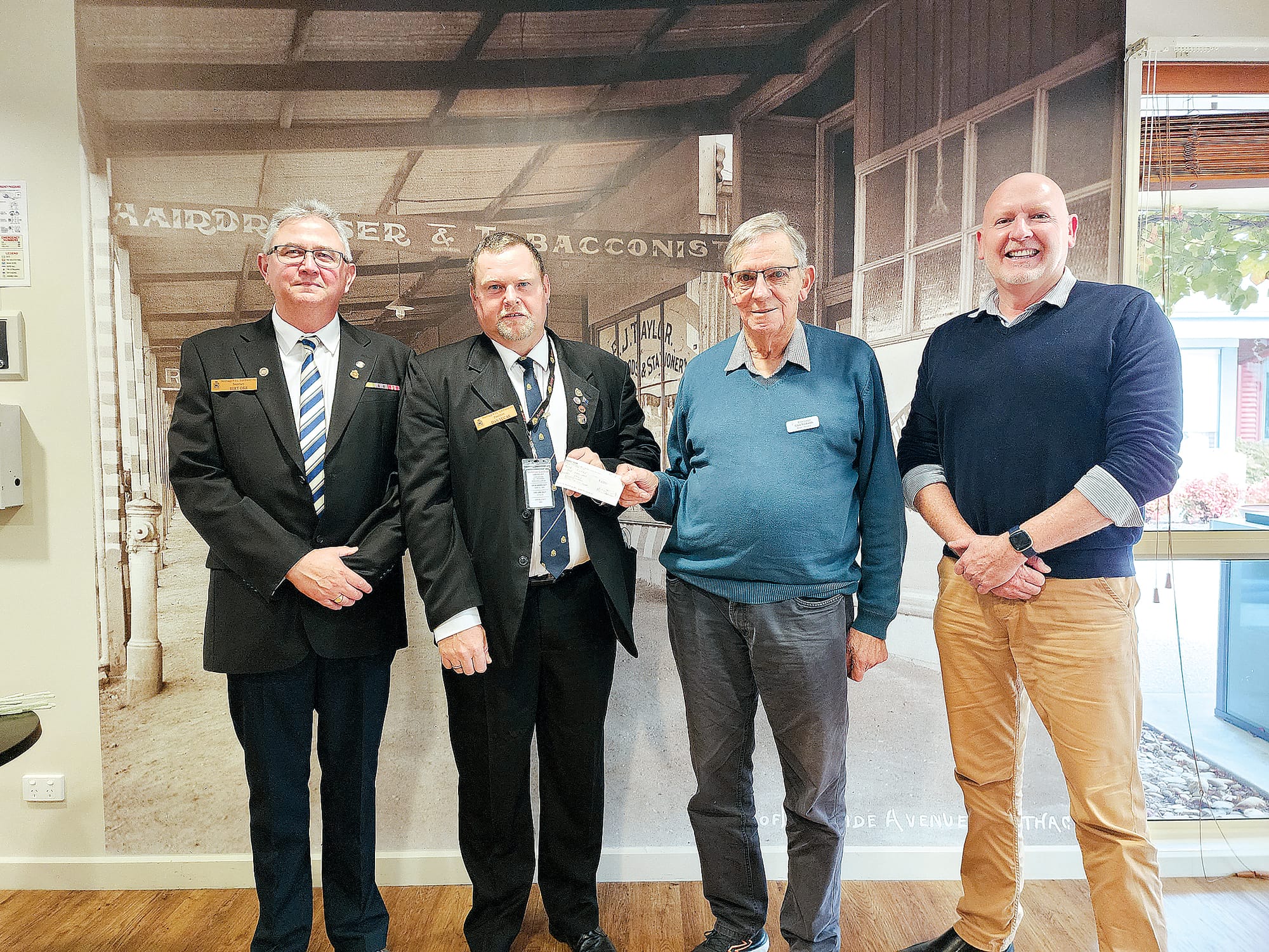 RSL Secretary Bert Orr and President Dan Lucas present Rose Lodge Board President Glen Richards and CEO Shane Jenkins with the cheque for $1000 that will go towards completing ANZAC Cove at Rose Lodge.