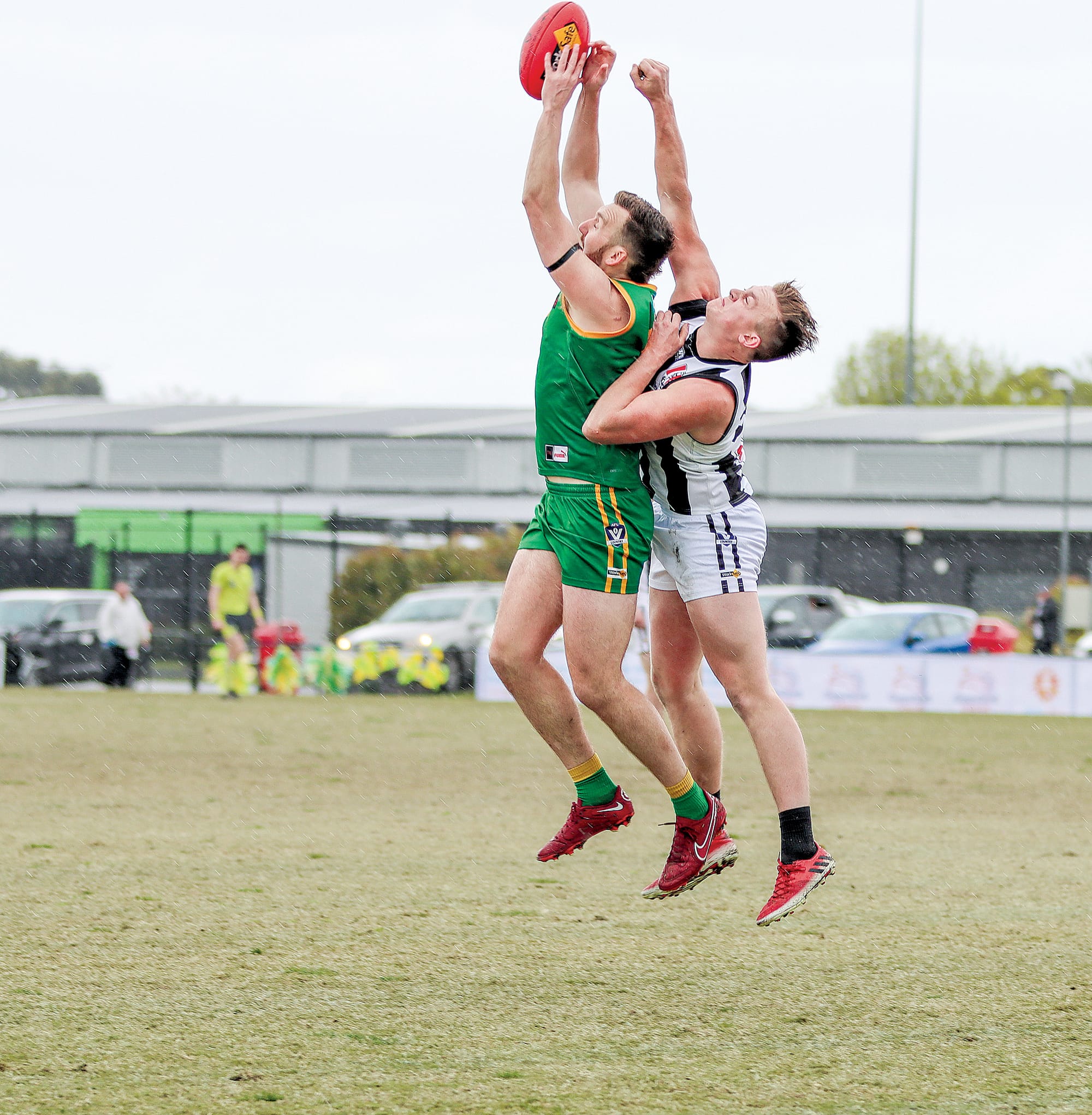 Nick Nagel tries to get a grip on the Sherrin while coming under intense pressure from his Sale opponent.