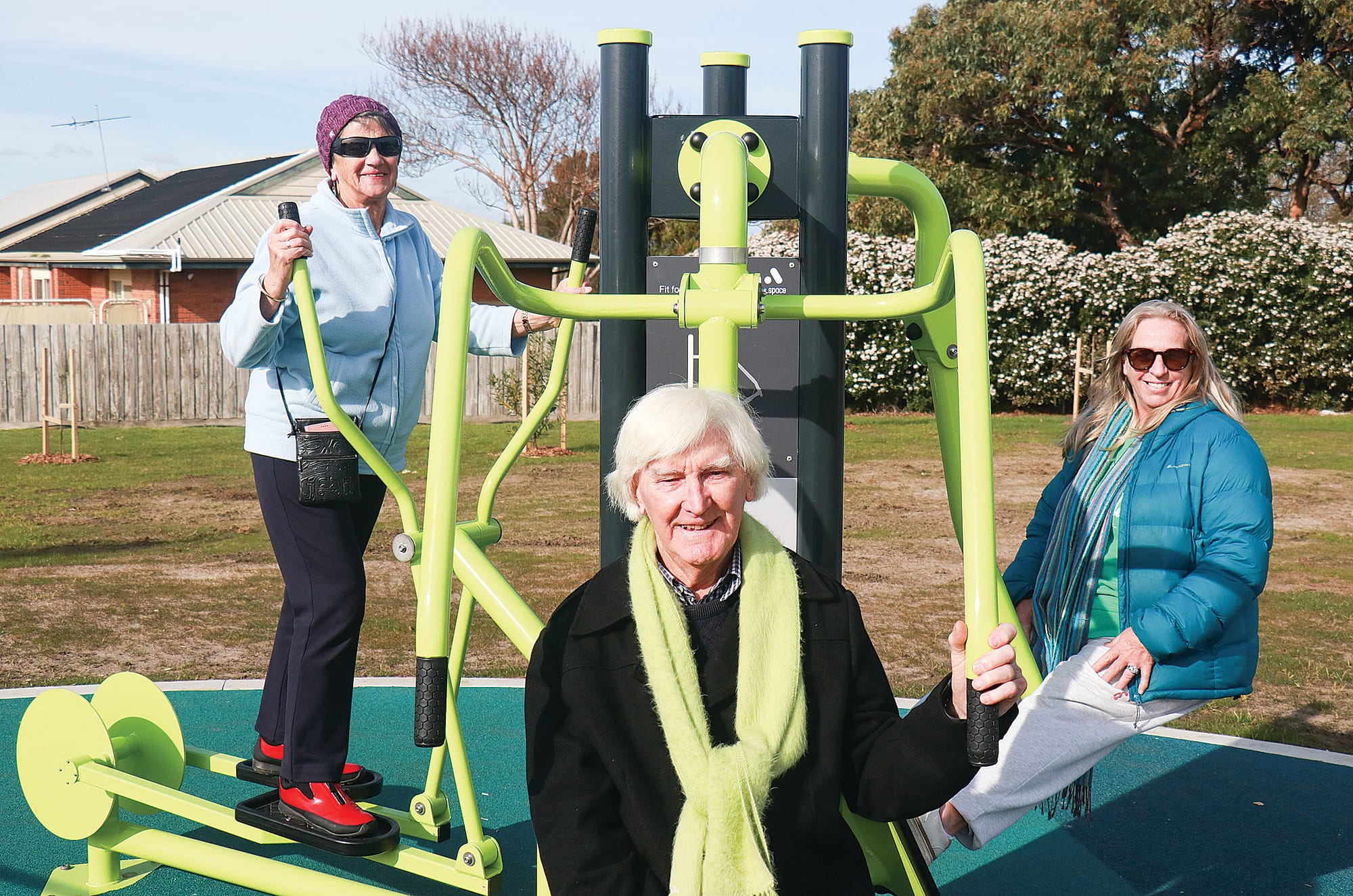 Sandra Thorley, Emma O’Neill and Graeme Clauscen together advocated with Thelma Born for the multipurpose, all age community space. Pictured here trying out the new exercise equipment onsite. Z09_3324