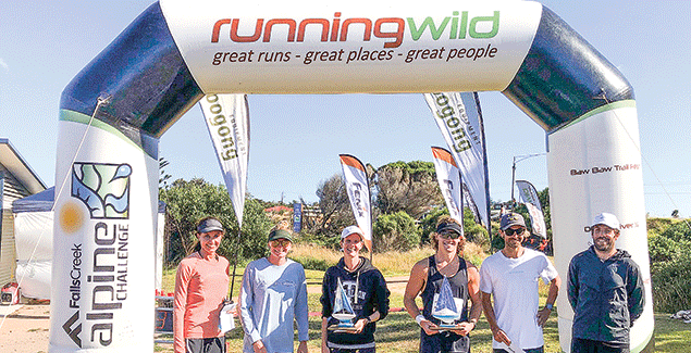 Competitors run the coastal trail