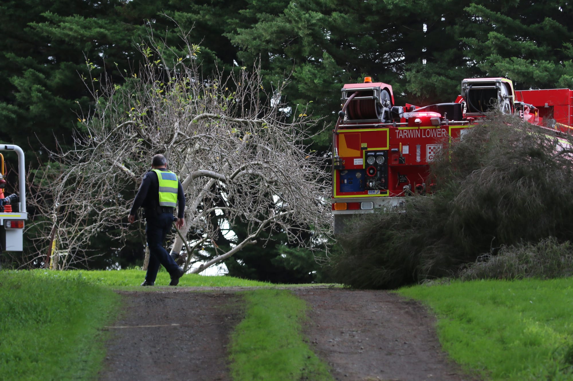 Police patrol the scene of a farmhouse first at Pound Creek after reports of asbestos in the old structure.