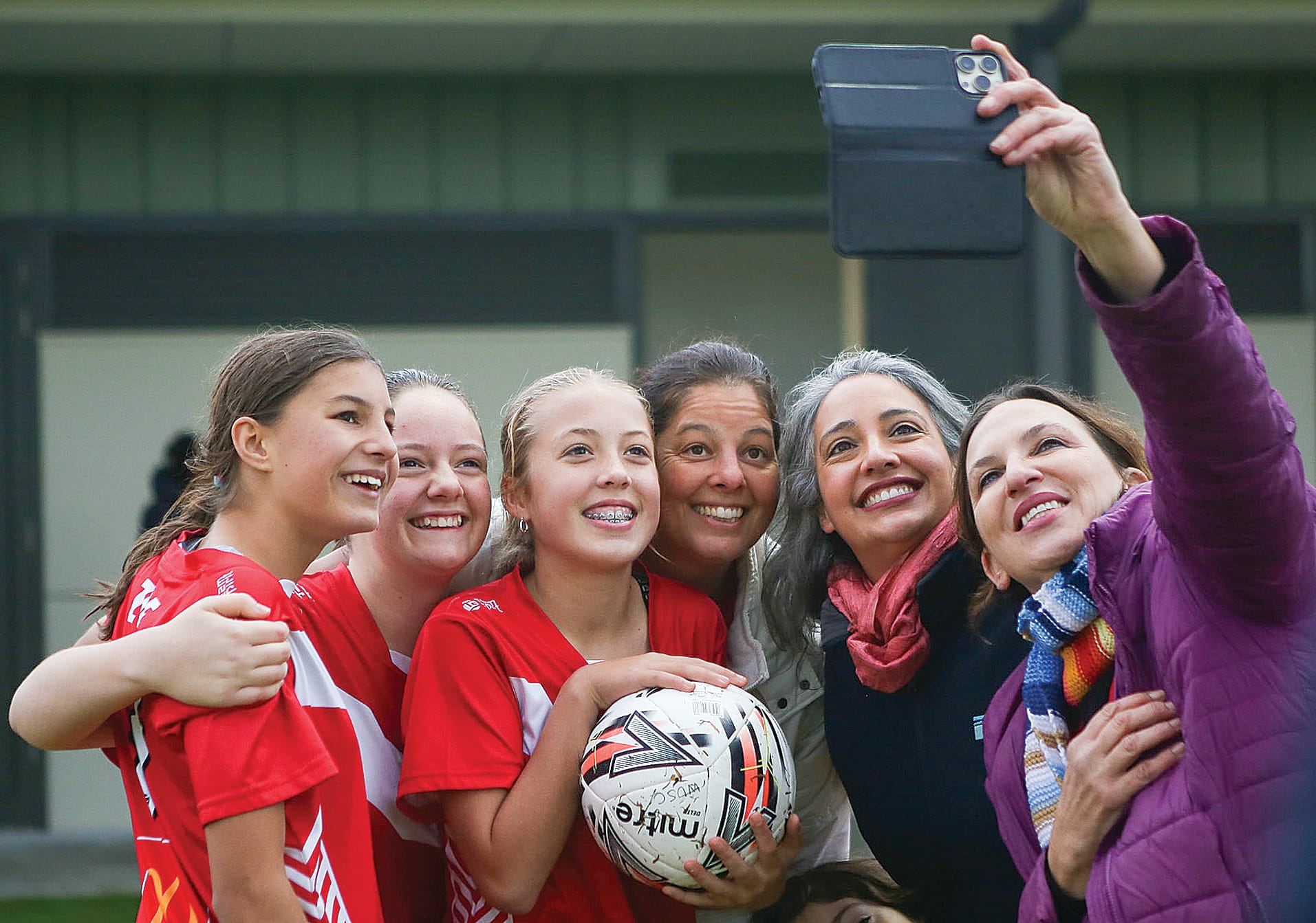 Local Member for Bass Jordan Crugnale MP and Cr Leticia Laing took a moment ahead of the match to secure a photo with Wonthaggi United players.