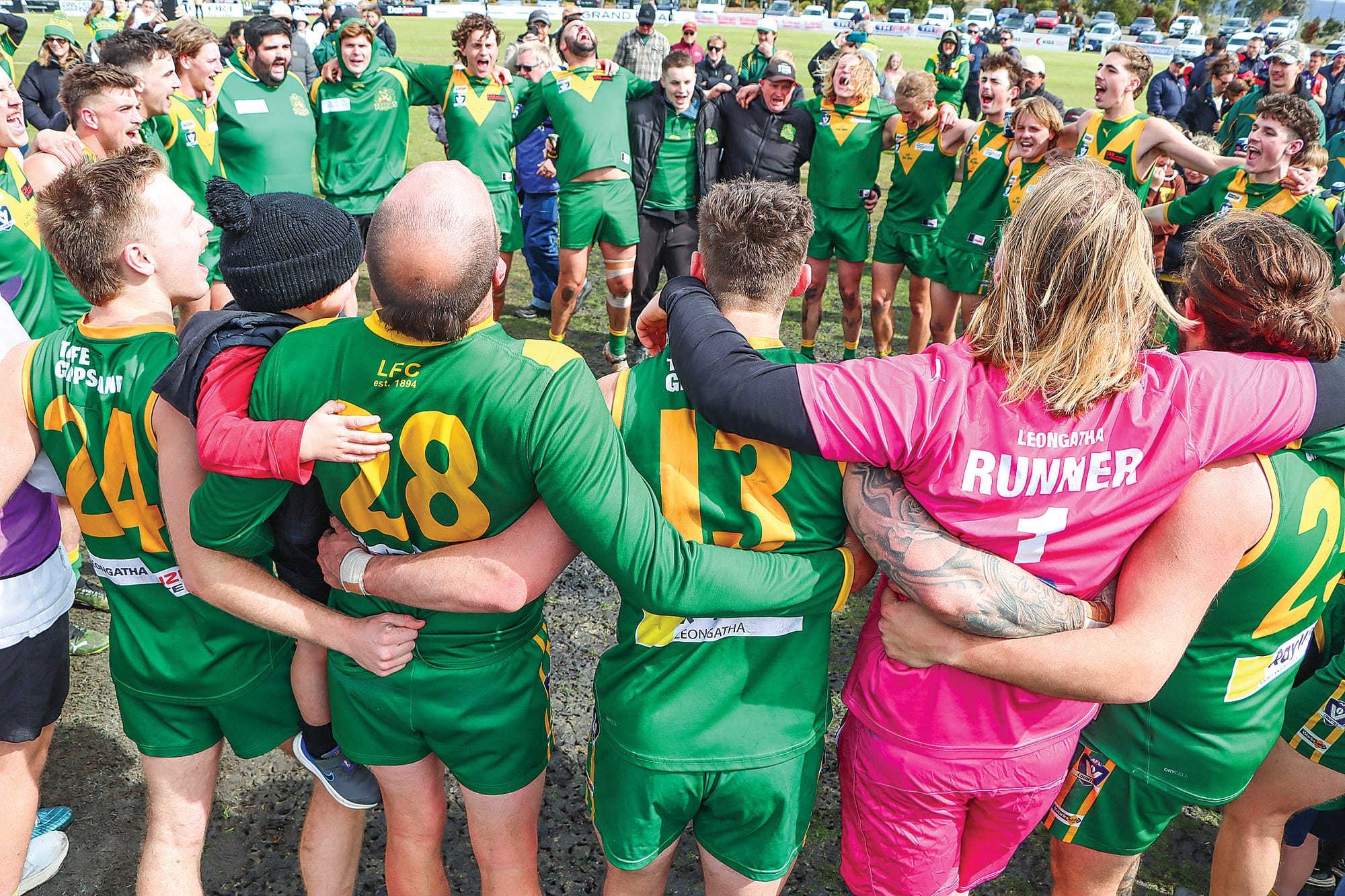 Leongatha players sing with gusto after completing the club’s third Reserves premiership in a row. A56_3924