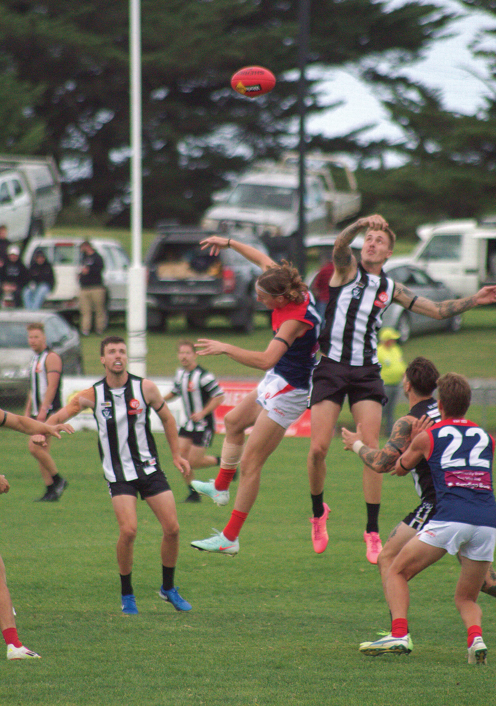 Demons and Magpies wait to pounce as Dalyston and Koo Wee Rup compete in the ruck. Photo: Angus Chisholm.
