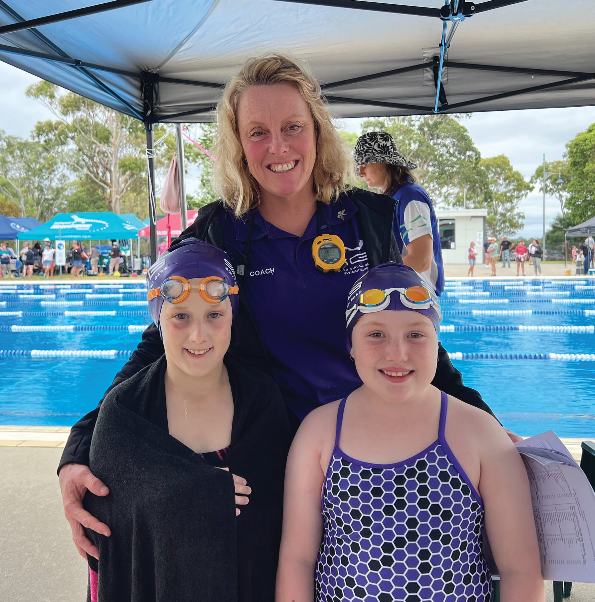South Gippsland Bass coach Lorri with her charges Hannah and Abbie.