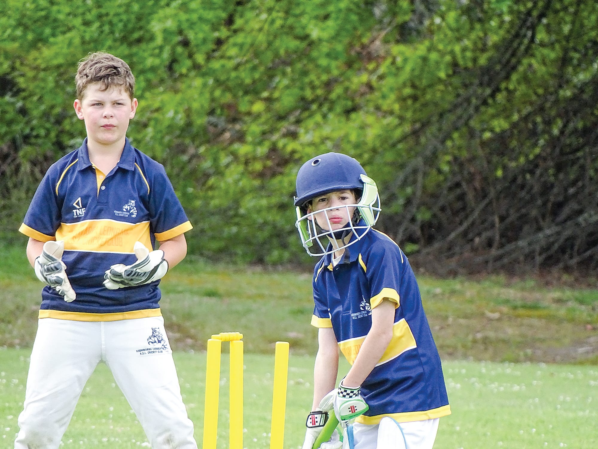 Julian Riccardi batting for Koonwarra Leongatha RSL with William Buckley wicket keeping, watching on.