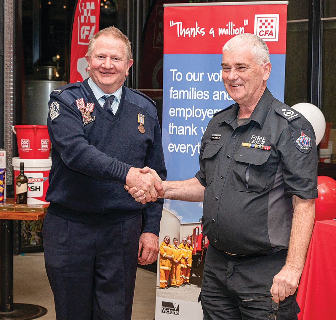 CFA Catchment Commander Gavin Parker presenting thirty-year service award to Ross Harris.