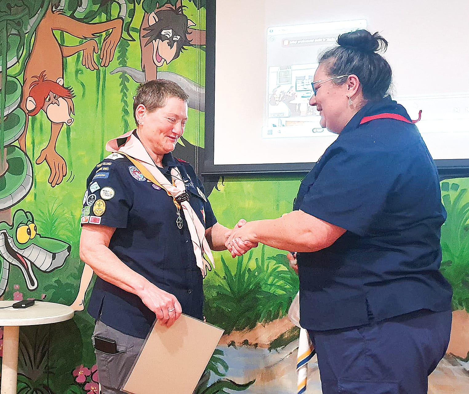 Robyn Mylius, Group Leader of Phillip Island receiving her wood badge, from Cathy Cook of 1st&nbsp;Yarram Scouts. The WoodBadge is the highest training level for adult volunteers in Scouting.&nbsp;