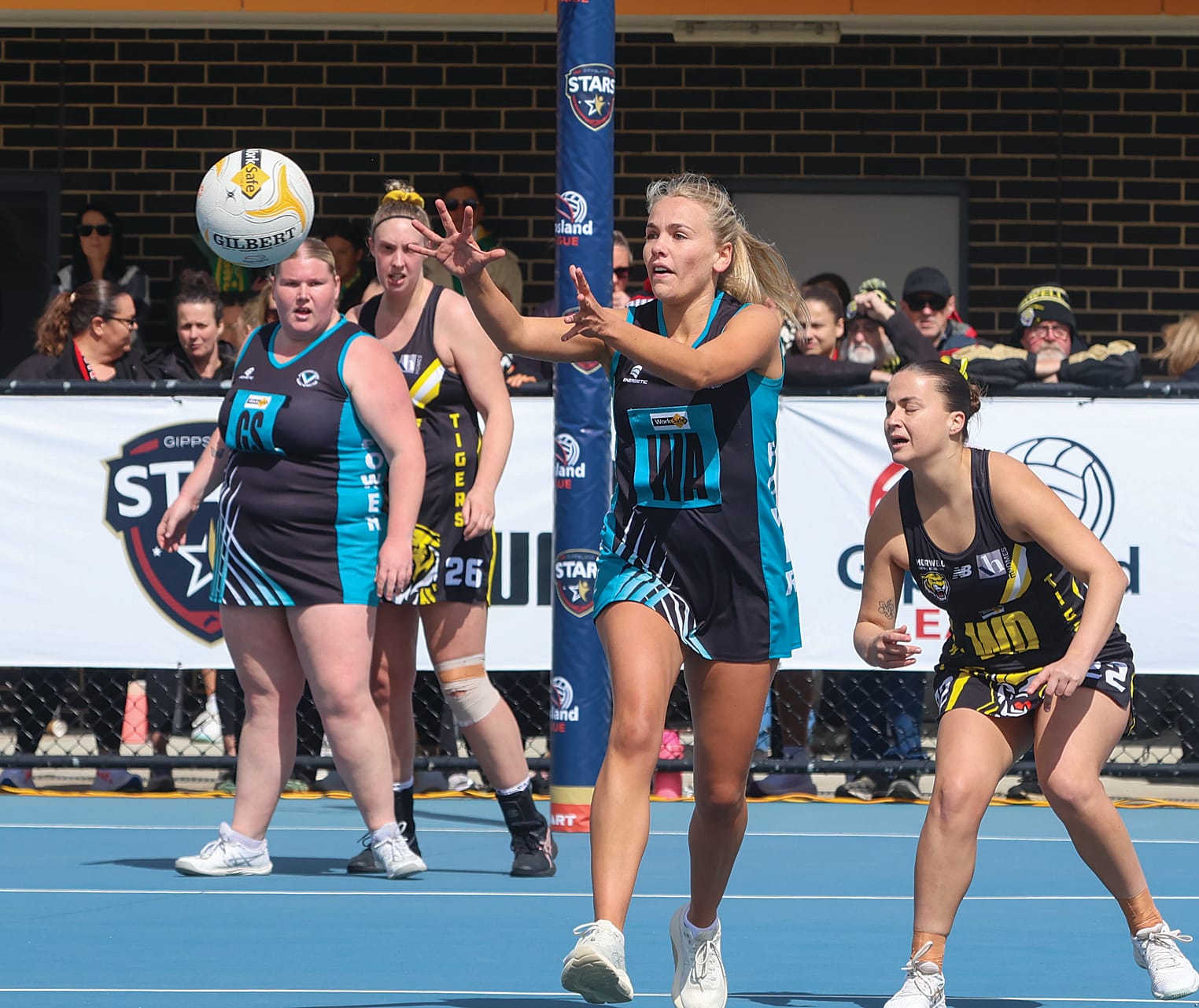 Wonthaggi wing attack in C Grade Libby Hutchinson passes the ball forward in midcourt.