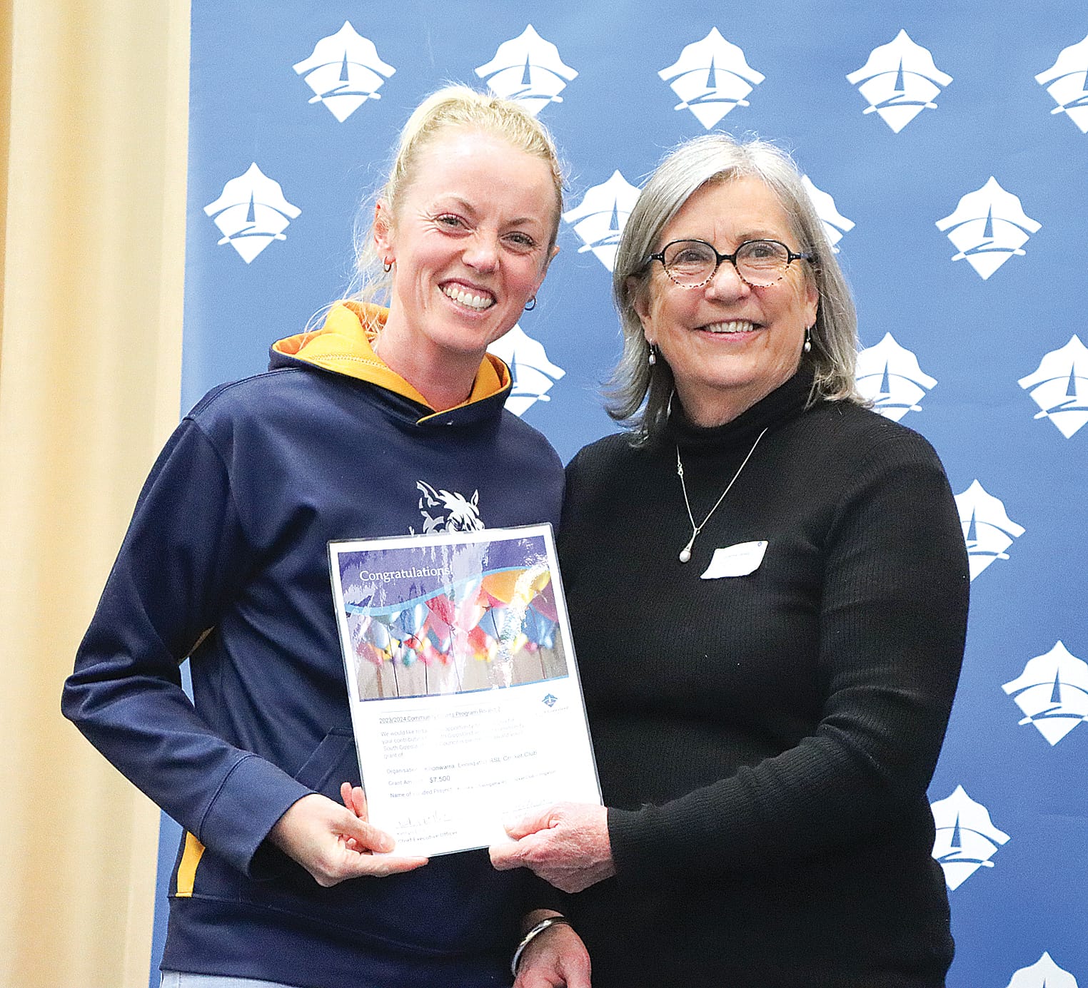 Jodie Arnup accepts $7500 on behalf of Koonwarra/Leongatha RSL Cricket Club to help with its irrigation project, with Cr Mohya Davies. A15_3124