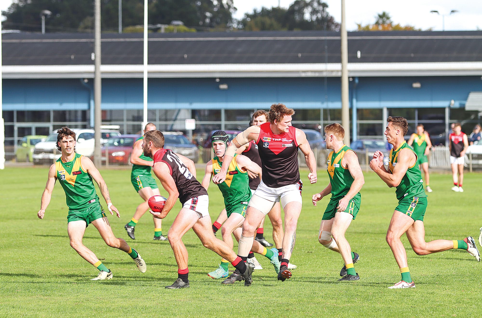 Warragul looks to break away from Leongatha during the first quarter of Senior action. A14_1924