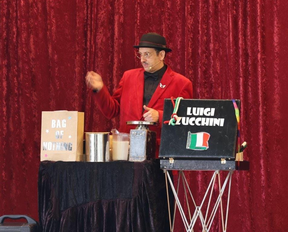 Magician Luigi Zucchini keeps the crowd entertained in the Fish Creek Hall during the Fishy Stories Festival.