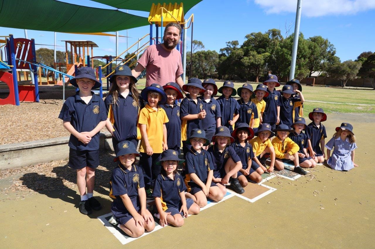 Liam Jury gets his year 1-2 class out for a bit of exercise on Friday during the first week back at school.