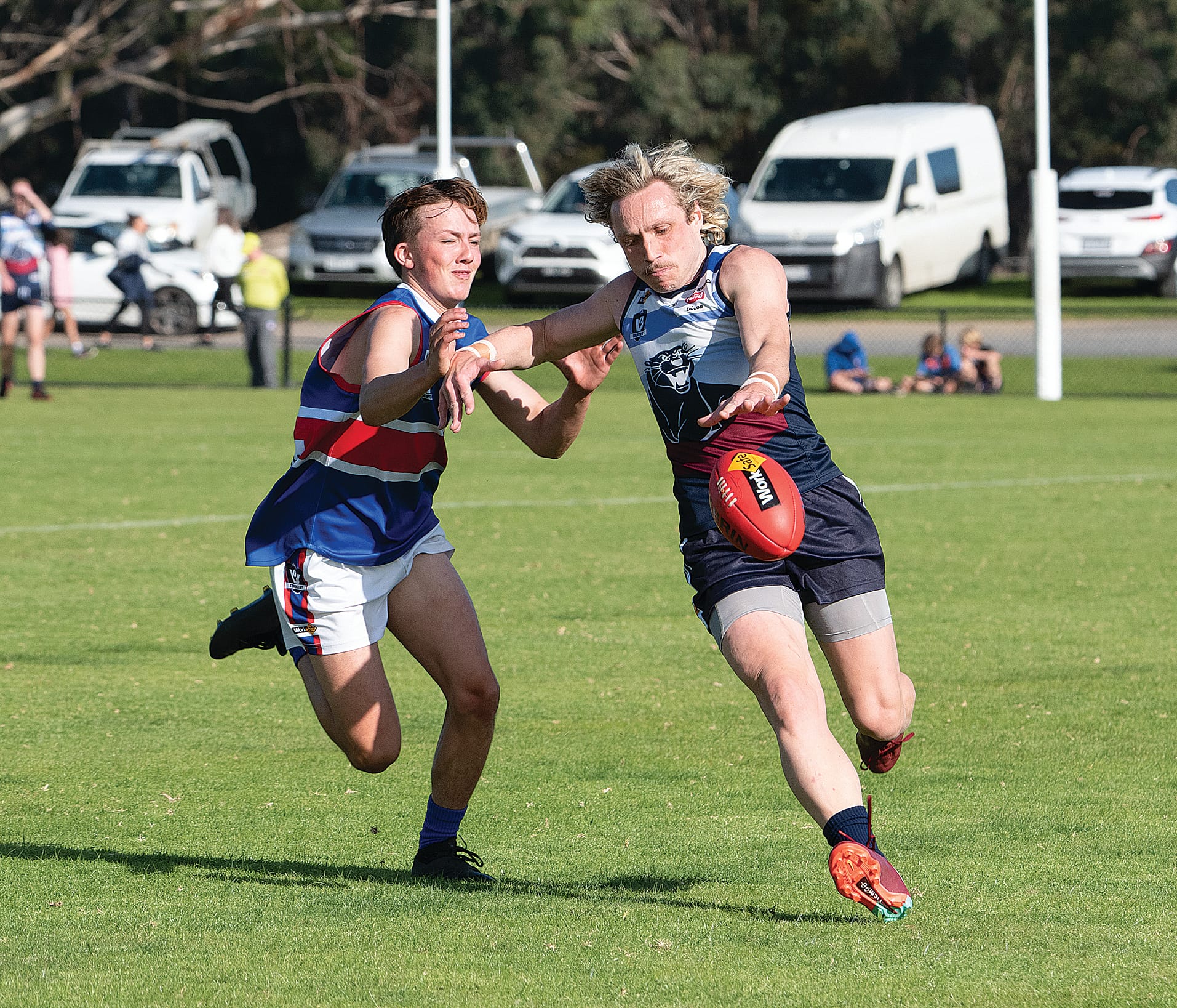 Kilcunda-Bass’ Jake Weightman accelerates with the ball and sends it into his teams forward fifty.