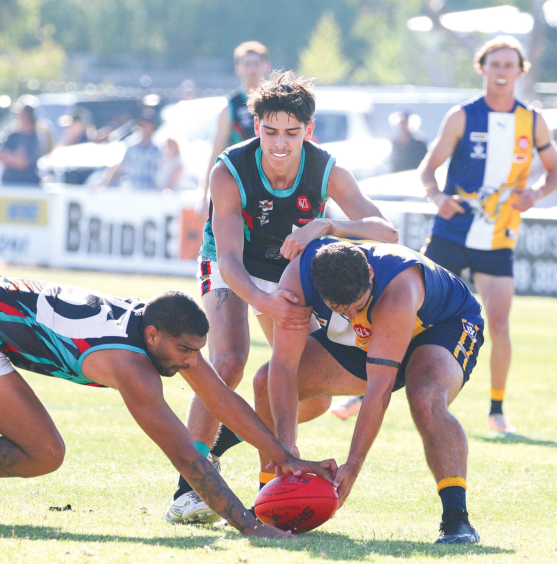 Dylan Clark battles for the ball will Cora Lynn’s William Thomas