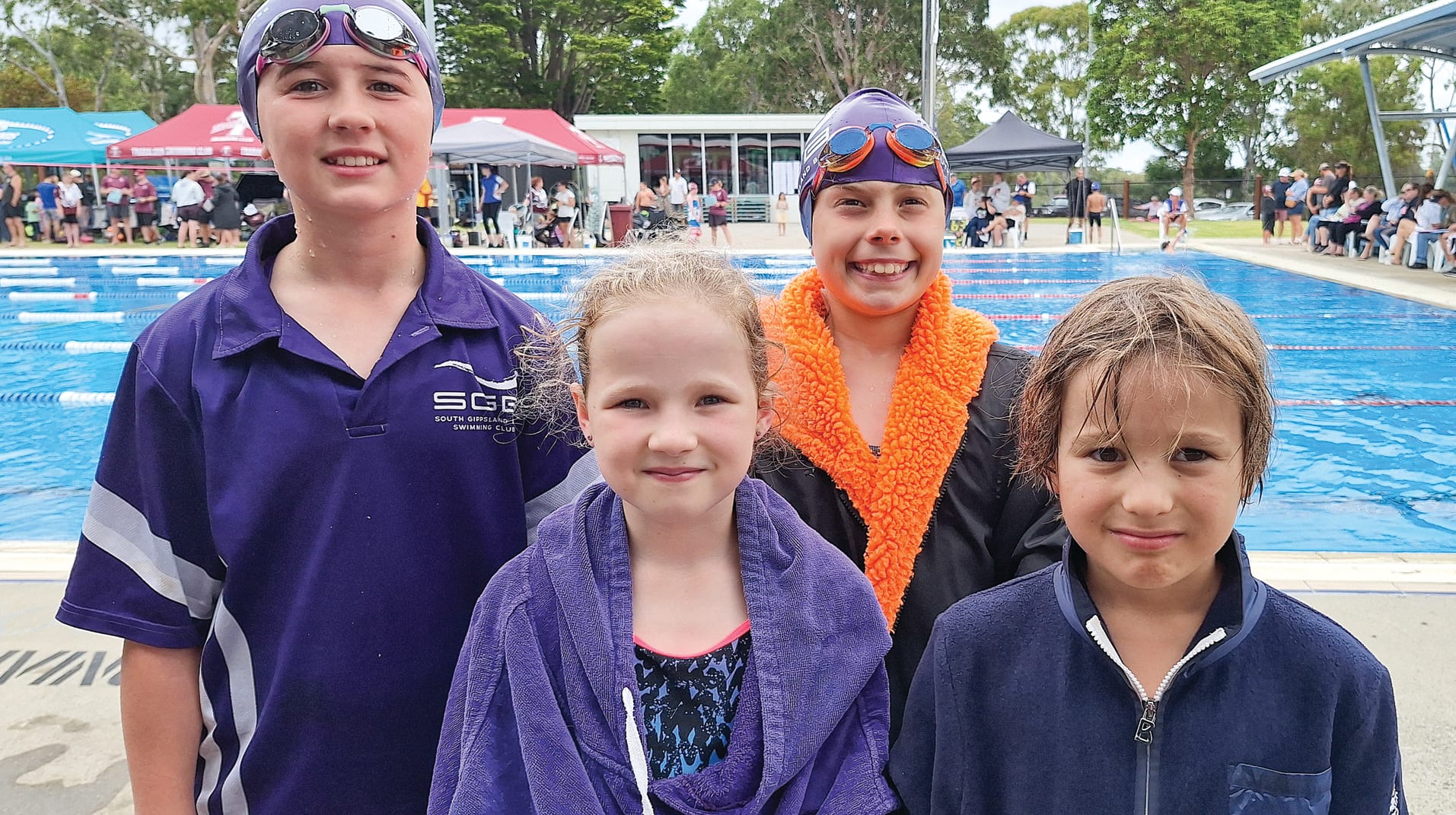 South Gippsland Bass swimmers Harper, Mya, Heidi and Matthew post race.