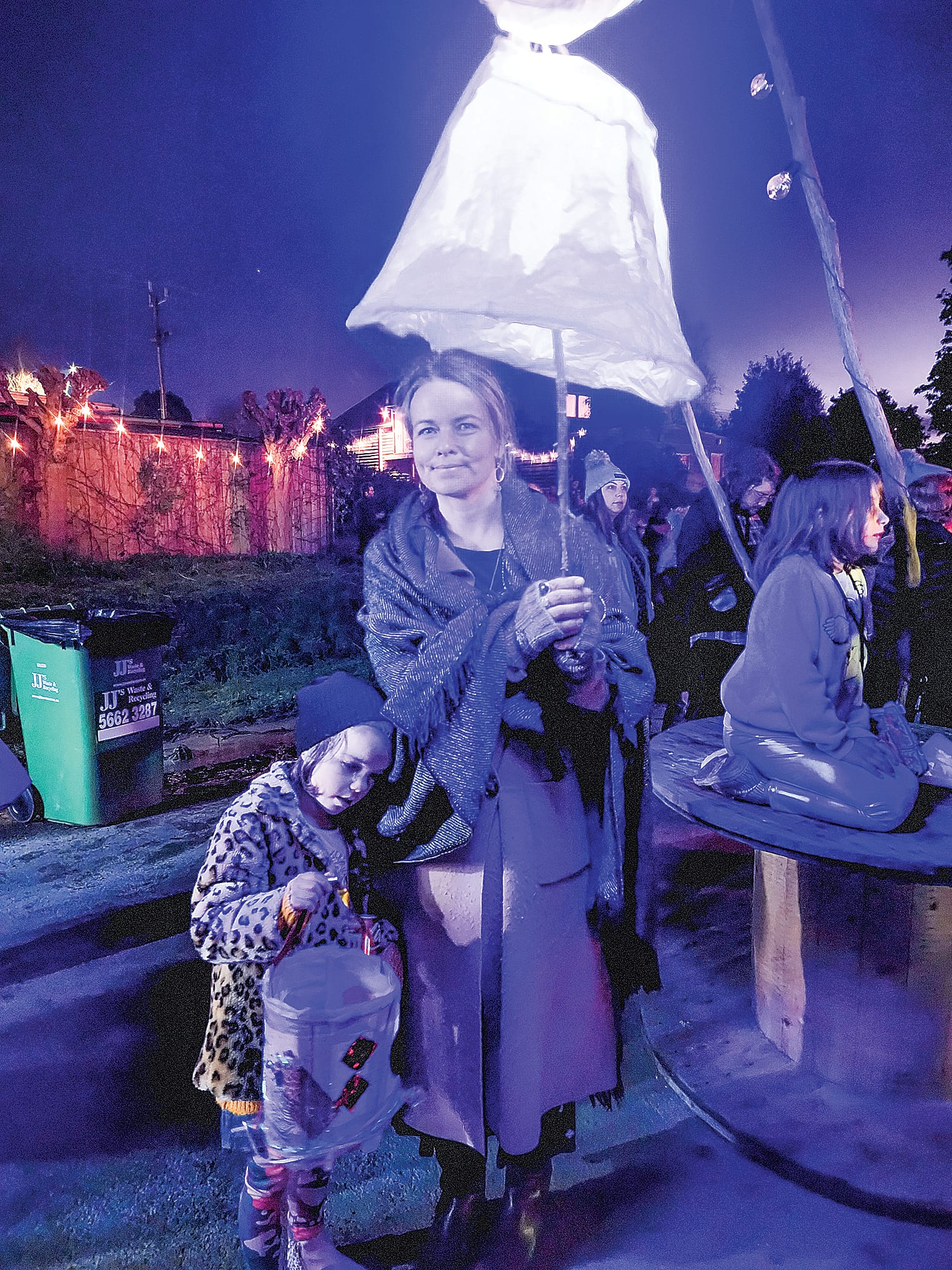Locals Lorelei and Ruth show their lanterns flickering between the colours of the rainbow. C48_3122