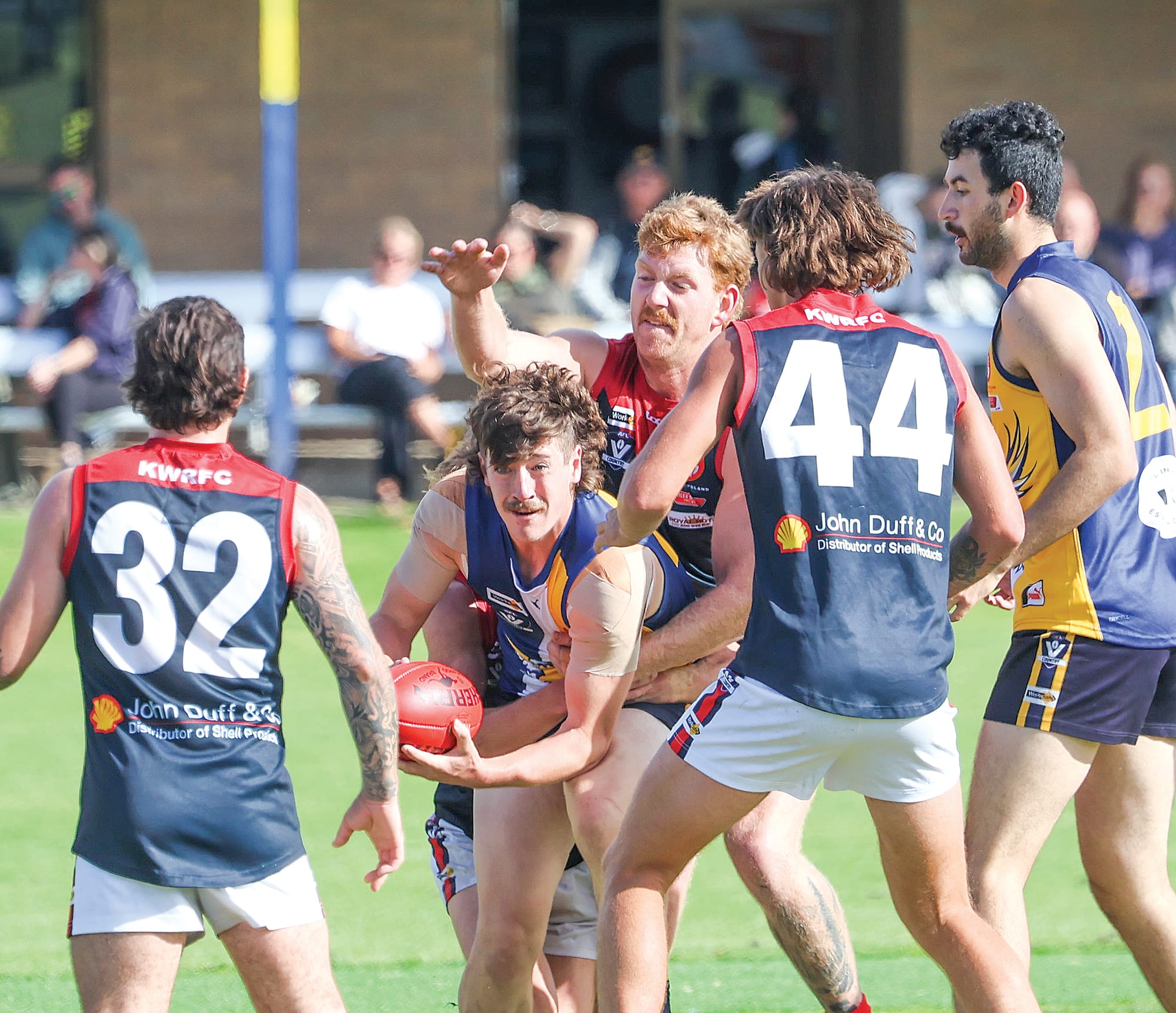I-K’s Jimmy Soumilas finds a way out of a congested centre scramble to get the ball going Inverloch-Kongwak’s way.