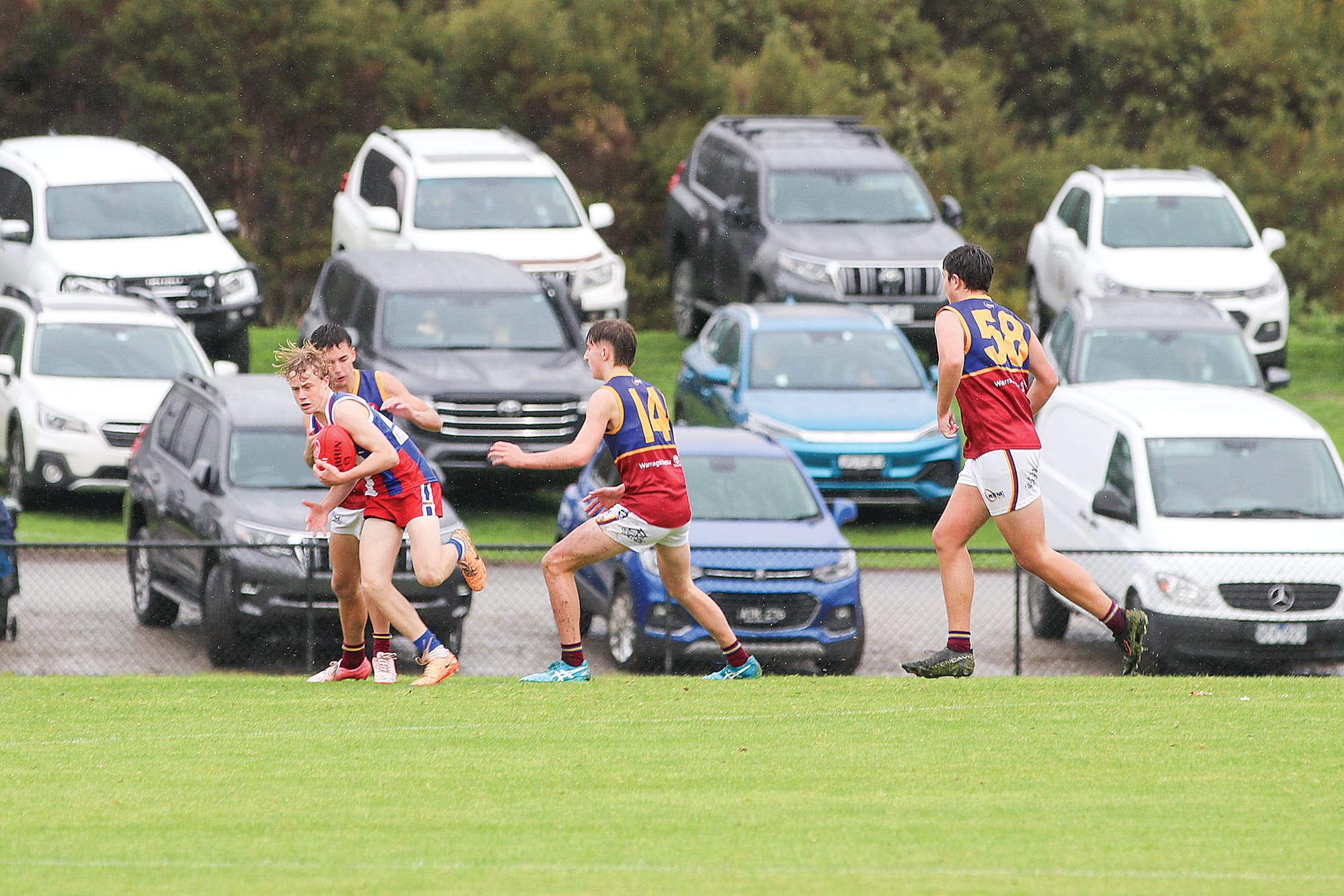 Phillip Island’s Levi Addison has possession in the grand final match against Warragul Industrials. Z09_3924