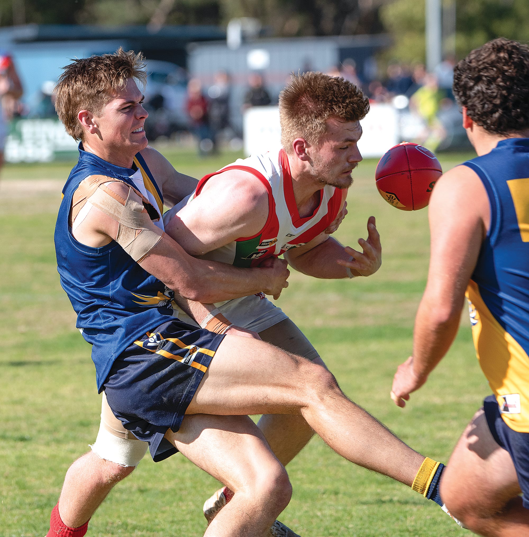 Tate Short applies pressure to his Tooradin-Dalmore opponent. Photo: Anna Carson.