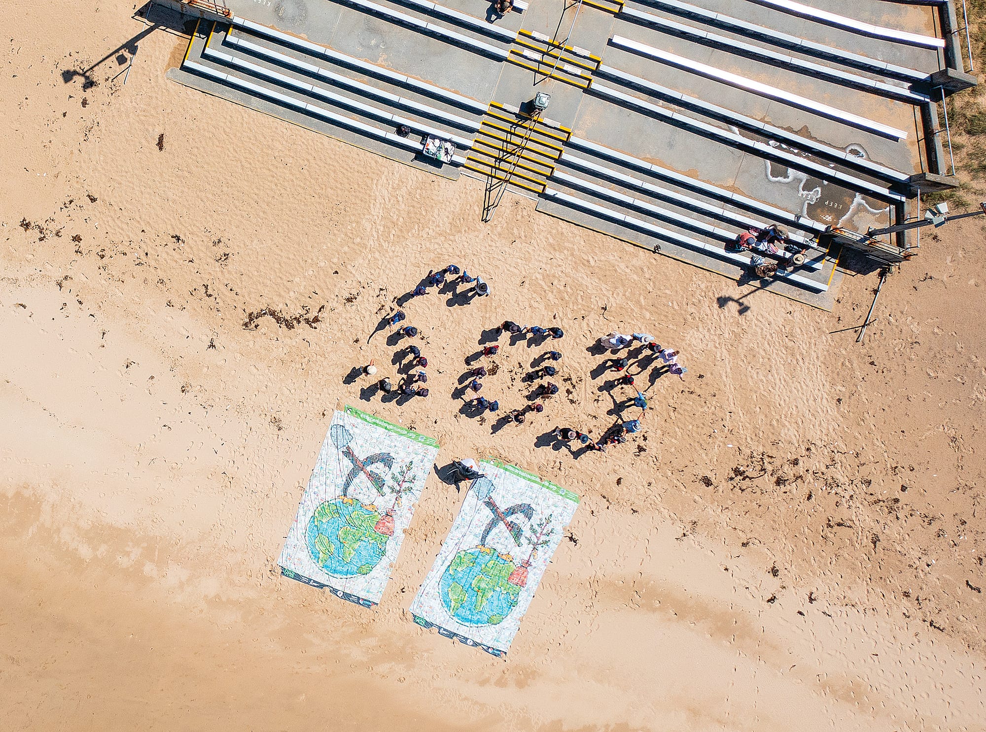 Students and volunteers spelt out SOS as they demand greater change to combat climate change. Photo: Joel Sharpe