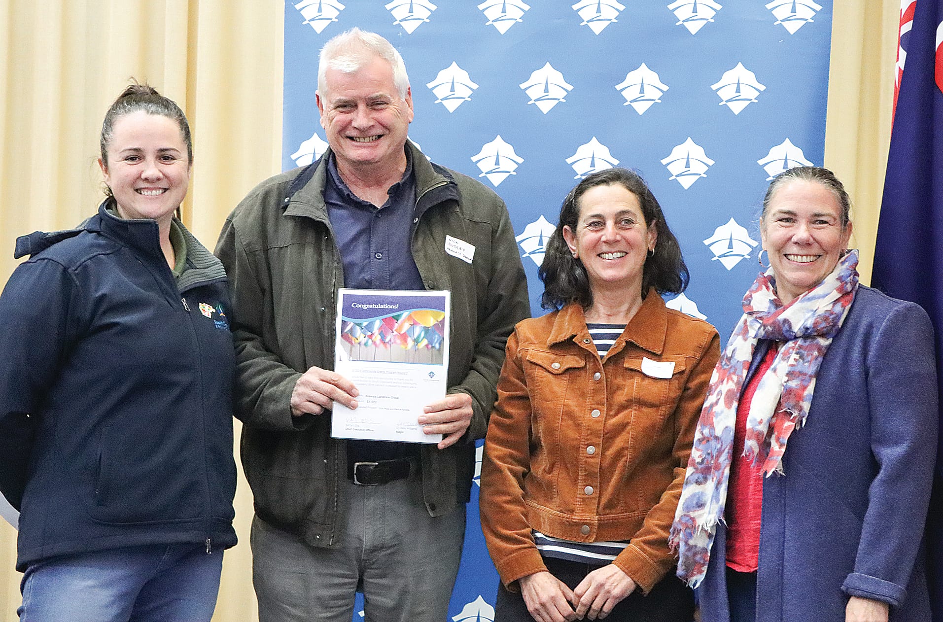Nick Dudley and Jo Sapir of Arawata Landcare Group receive $5000 to assist with the 2024 Pedal and Plant event at Kardella, with Mayor Clare Williams and Cr Sarah Gilligan. A10_3124