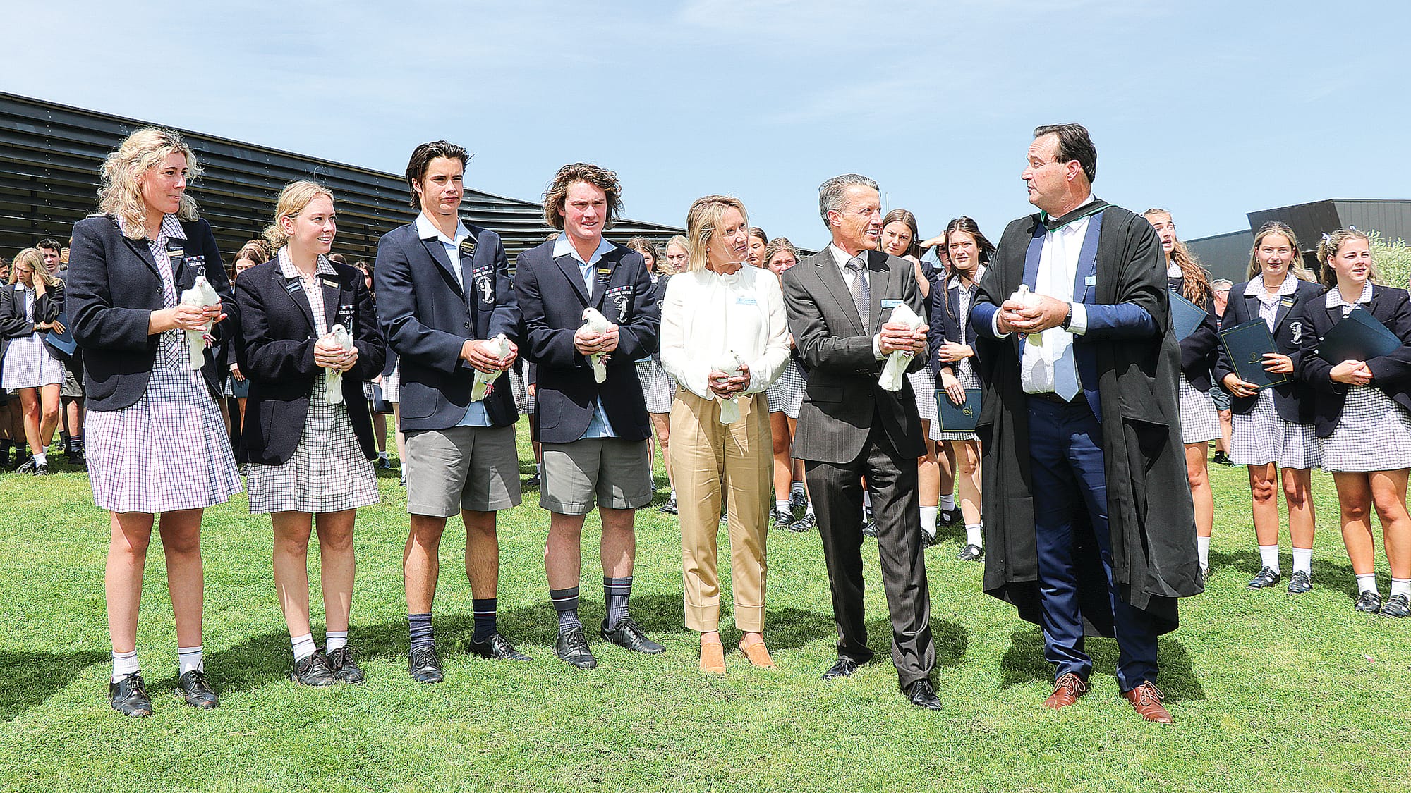 School captains Laura Vivian, Coco Hosken, Orlando Kane-Gillard and Jack Papas with Deputy Chairperson Megan White, Chairperson of Board David Jobe and Principal Tony Corr at the Newhaven College graduation ceremony. Z03_4223