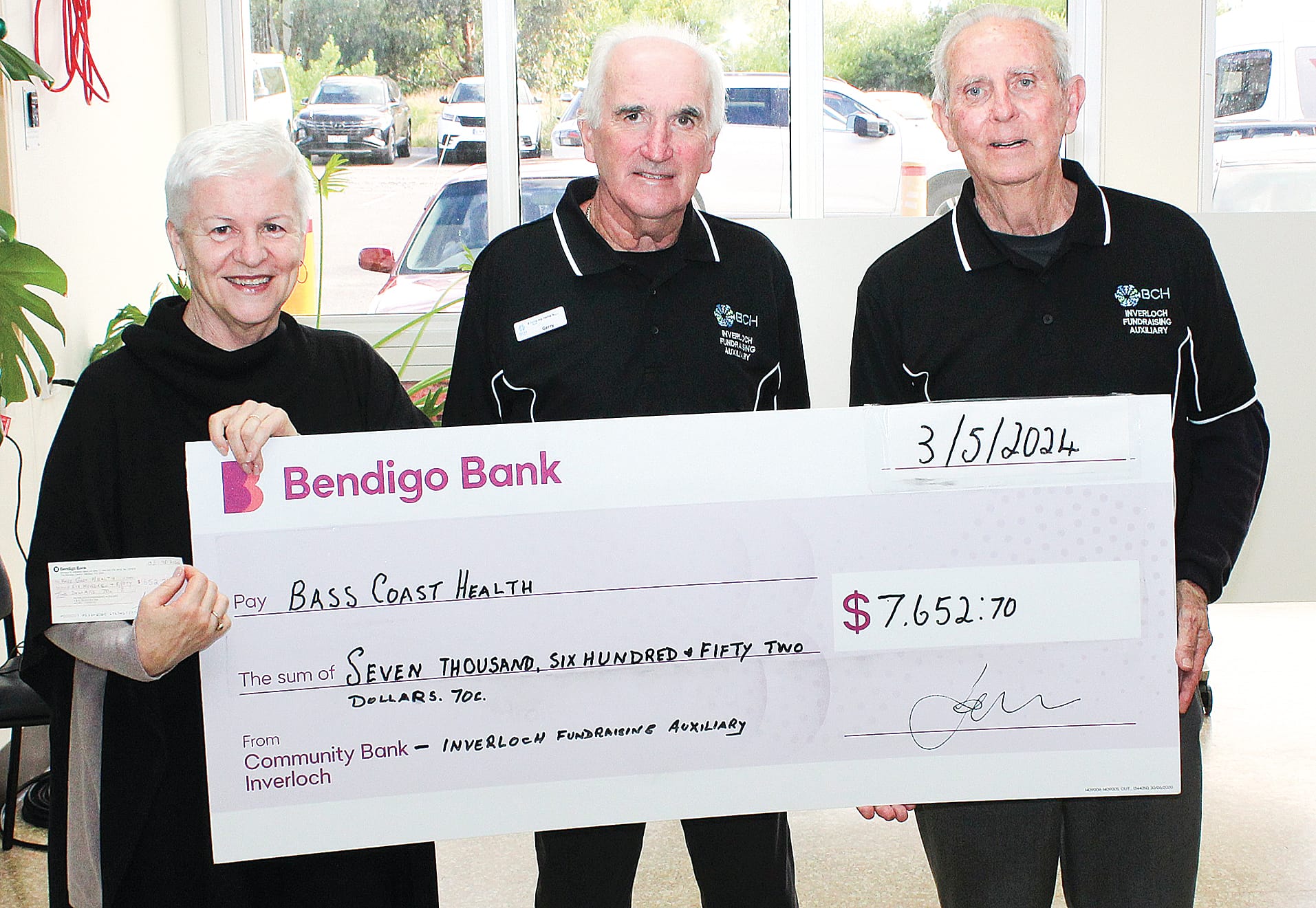 Inverloch Fundraising Auxiliary members Gerry Surridge and Terry Hall presented Bass Coast Health CEO Jan Child with a cheque for $7652.70 to buy a shower trolley for aged care residents at Kirrak House, Wonthaggi.