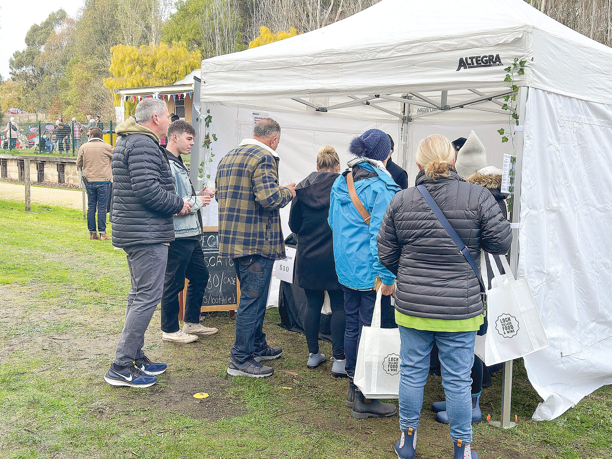 Punters lined up, keen to sample some of the wine at the festival. 