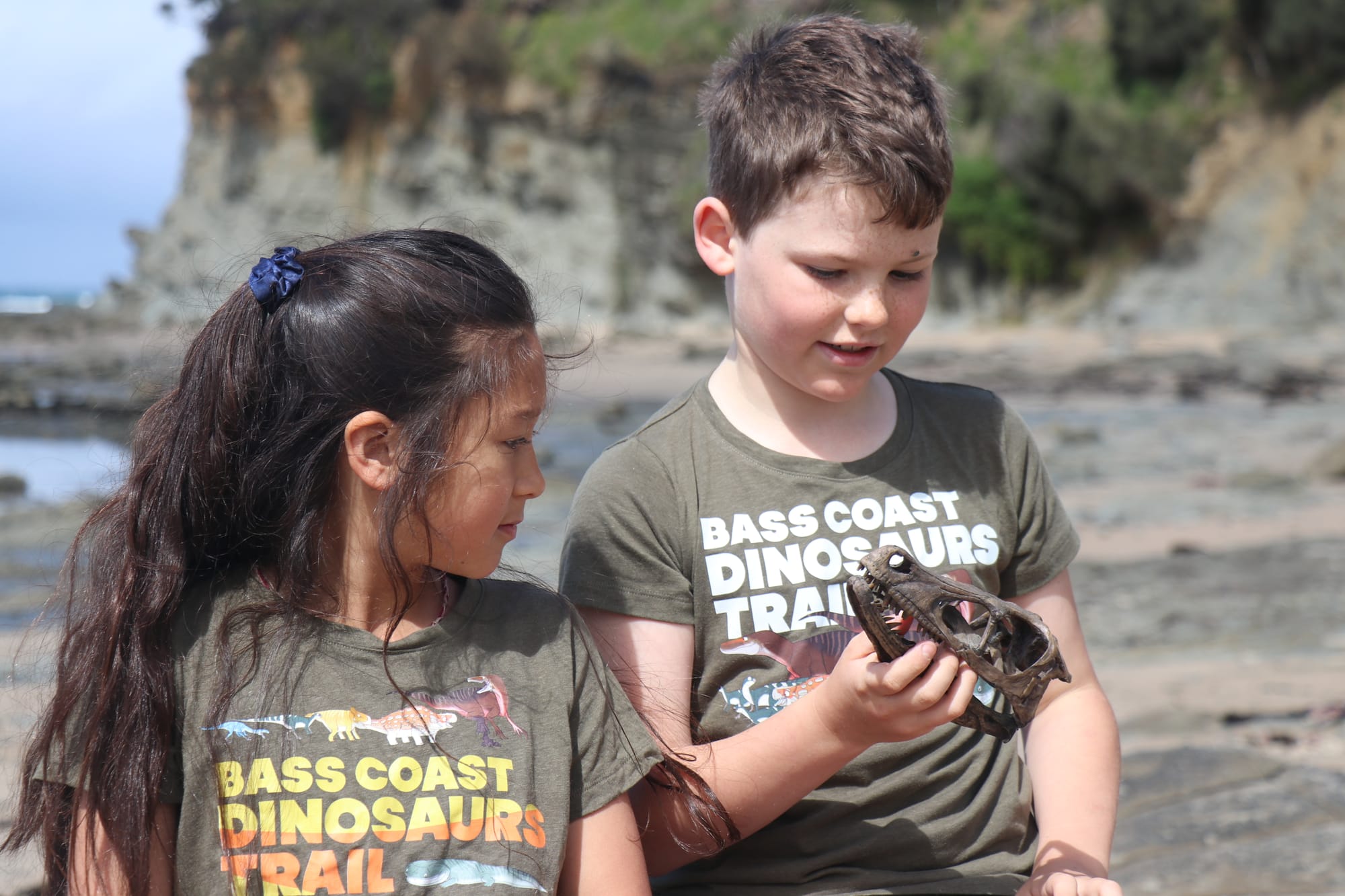 Grade three students at Inverloch Primary School, Zahli Koster and Lewis Huitema celebrate the launch of the Bass Coast Dinosaur Trail design phase. 