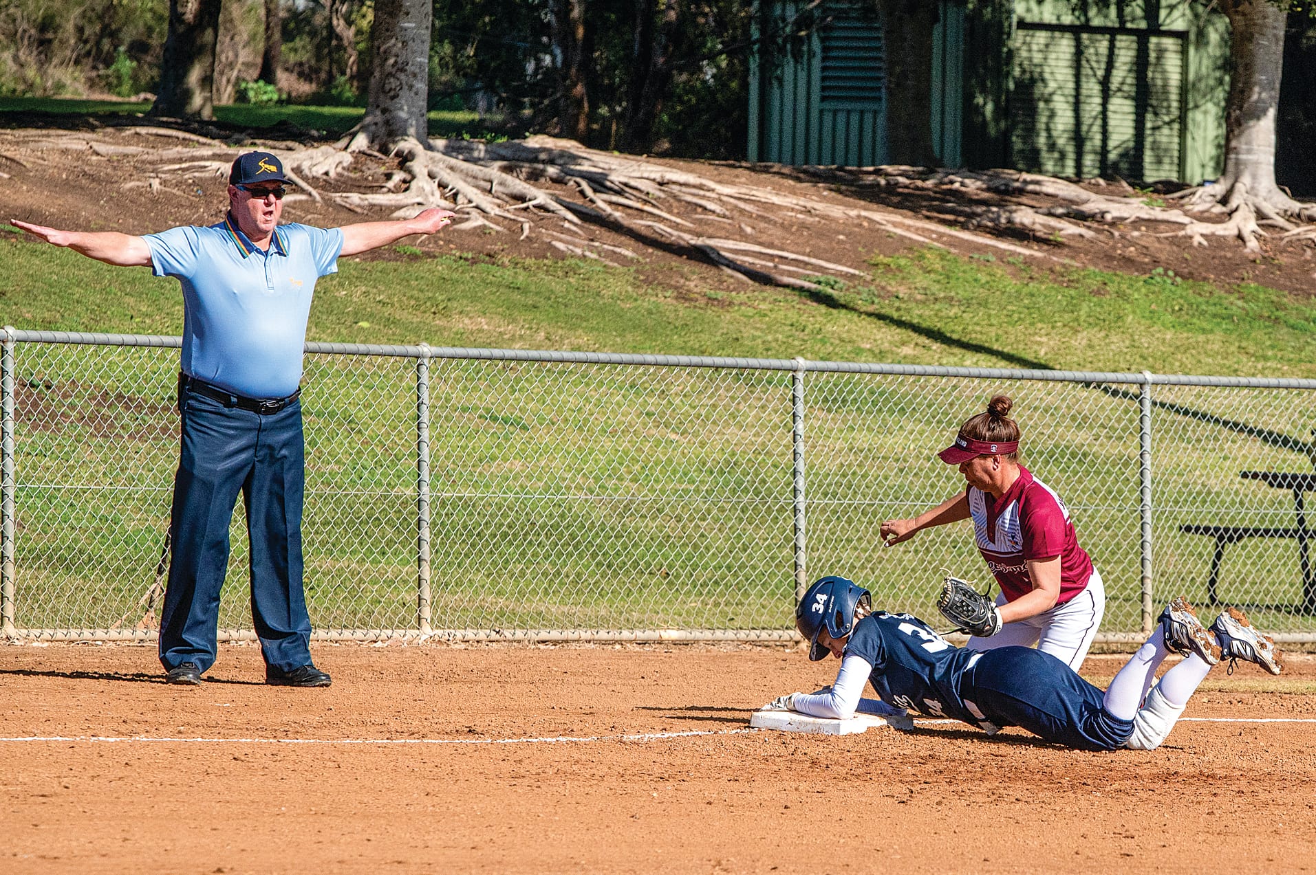 Melony Grand-Court, Softball Victoria representative, diving safe at Nationals. 
