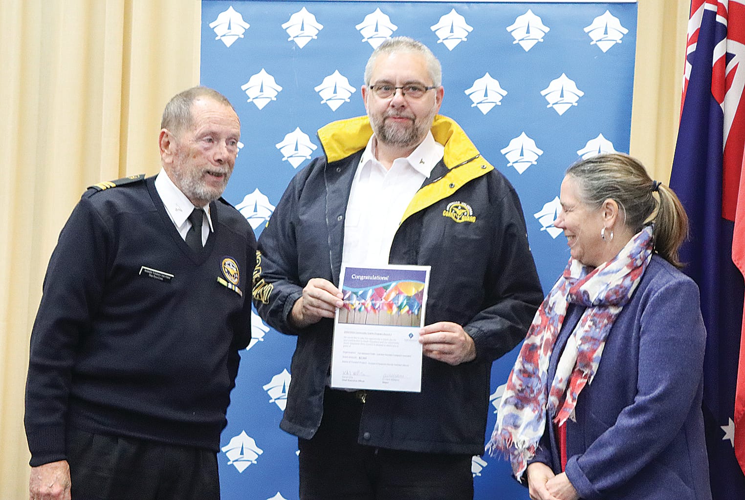 Peter Pryce-Lewis and Mark Leeworthy of Port Welshpool Flotilla – Australian Volunteer Coastguard Association pick up $2000 towards the cost of a remote controlled lifebuoy, with Cr Sarah Gilligan. A11_3124