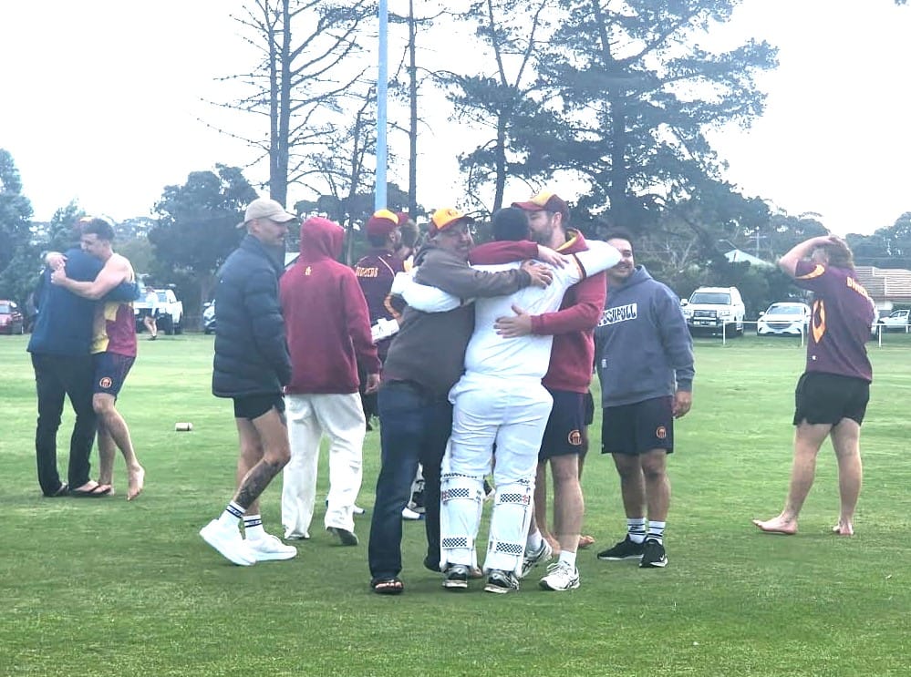 How did we just do that? OMK players and supporters embrace after captain Koby Brann hit the winning runs with just one wicket left.