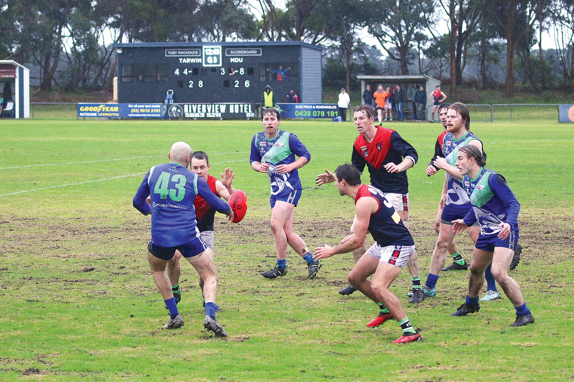 Daniel Houston contests the ball against his demons opponent as the other players are ready to jump in. ob05_3124