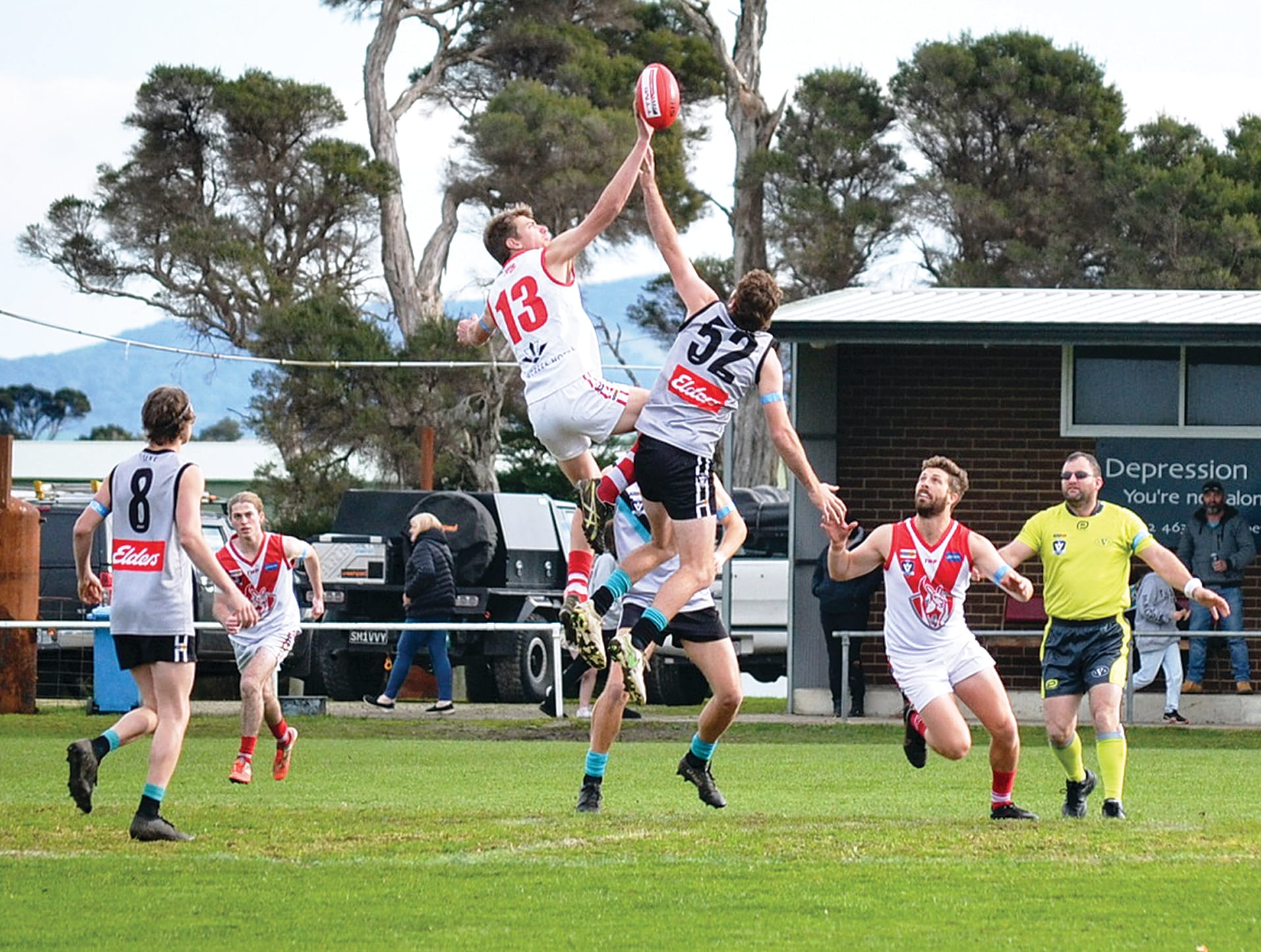 Fish Creek youngster Lachie Gale rises above his opponent with Jordan Shaw ready to pounce.