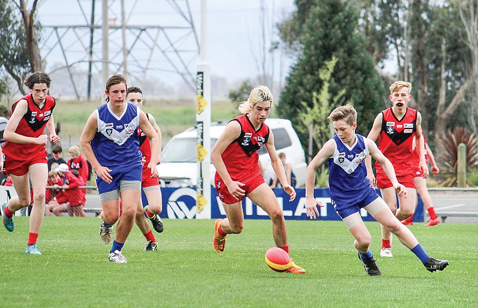 Southern Gippsland’s Jayden Burns approaches the ball, under pressure from an opponent.