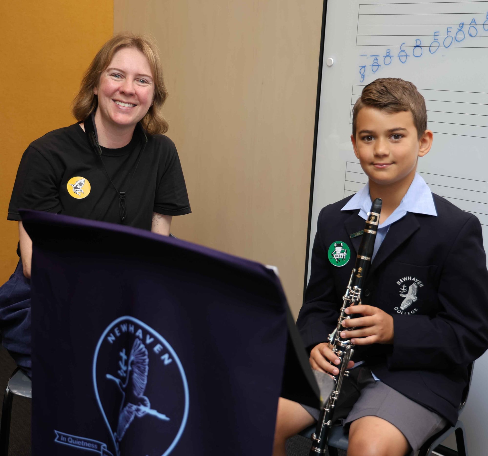 Newhaven College woodwind teacher Caroline Mahoney with William Christofi demonstrating the use of the college’s performing arts centre.