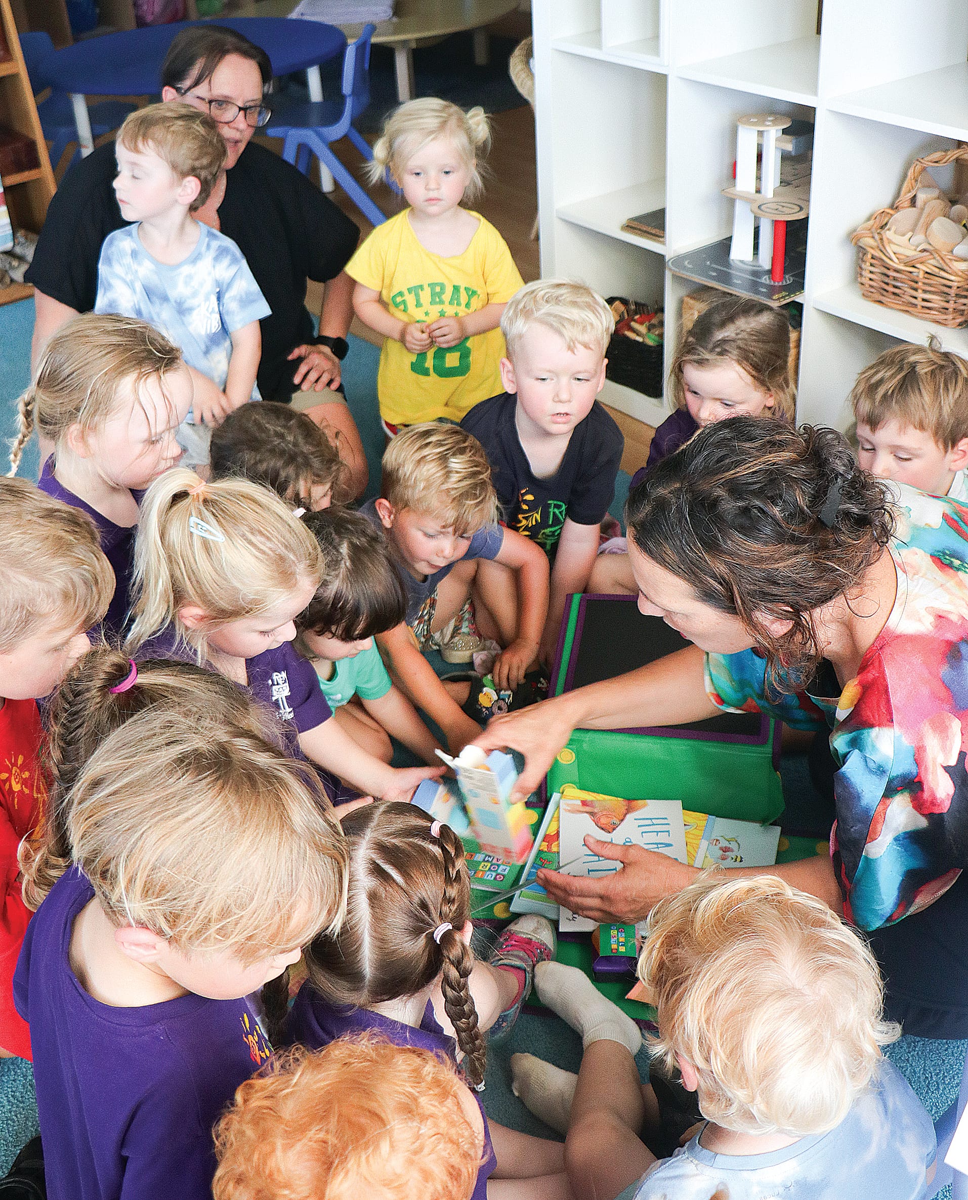 Bass MP Jordan Crugnale explores the kinder kits with the pre-school children. Z03_0824