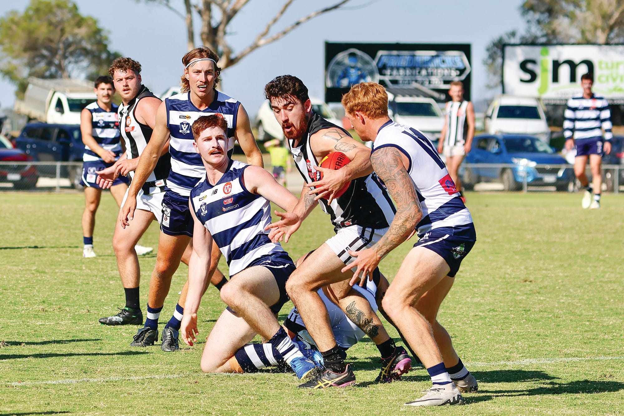 Dalyston’s Jesse Orchard-Moore finds the ball despite the close attention of the Goons. Photos: Kylie Pipicelli, Nar Nar Goon Football Netball Club.