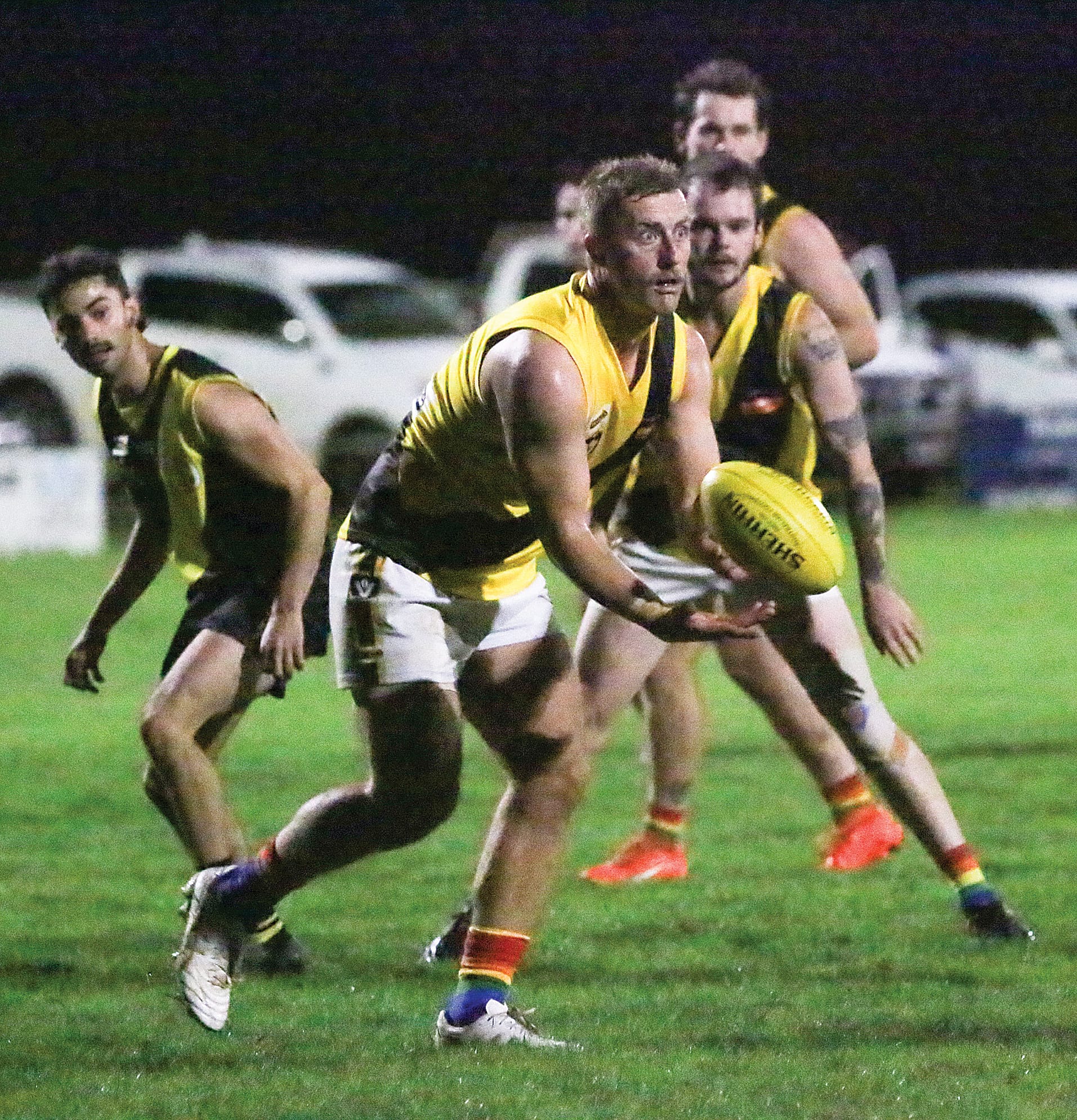 Foster’s Michael Howell works to move the play out of the danger of Mirboo North’s forward line. 