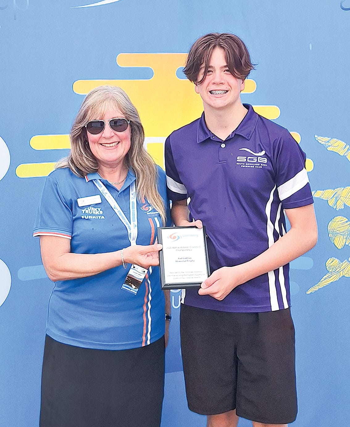 Archie Smyth celebrates winning the Rod Godfrey award for the highest aggregate score for a 13 and under Victorian swimmer.
