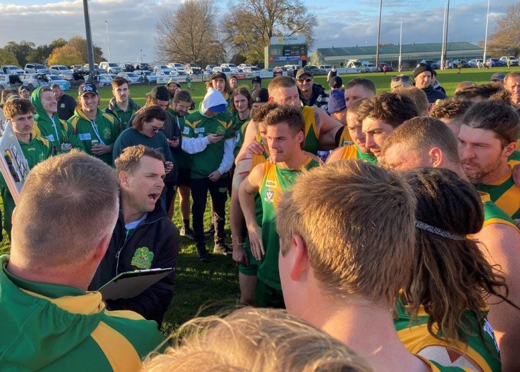 At three quarter time, Parrots' coach Trent McMicking  urges his players to take it on.