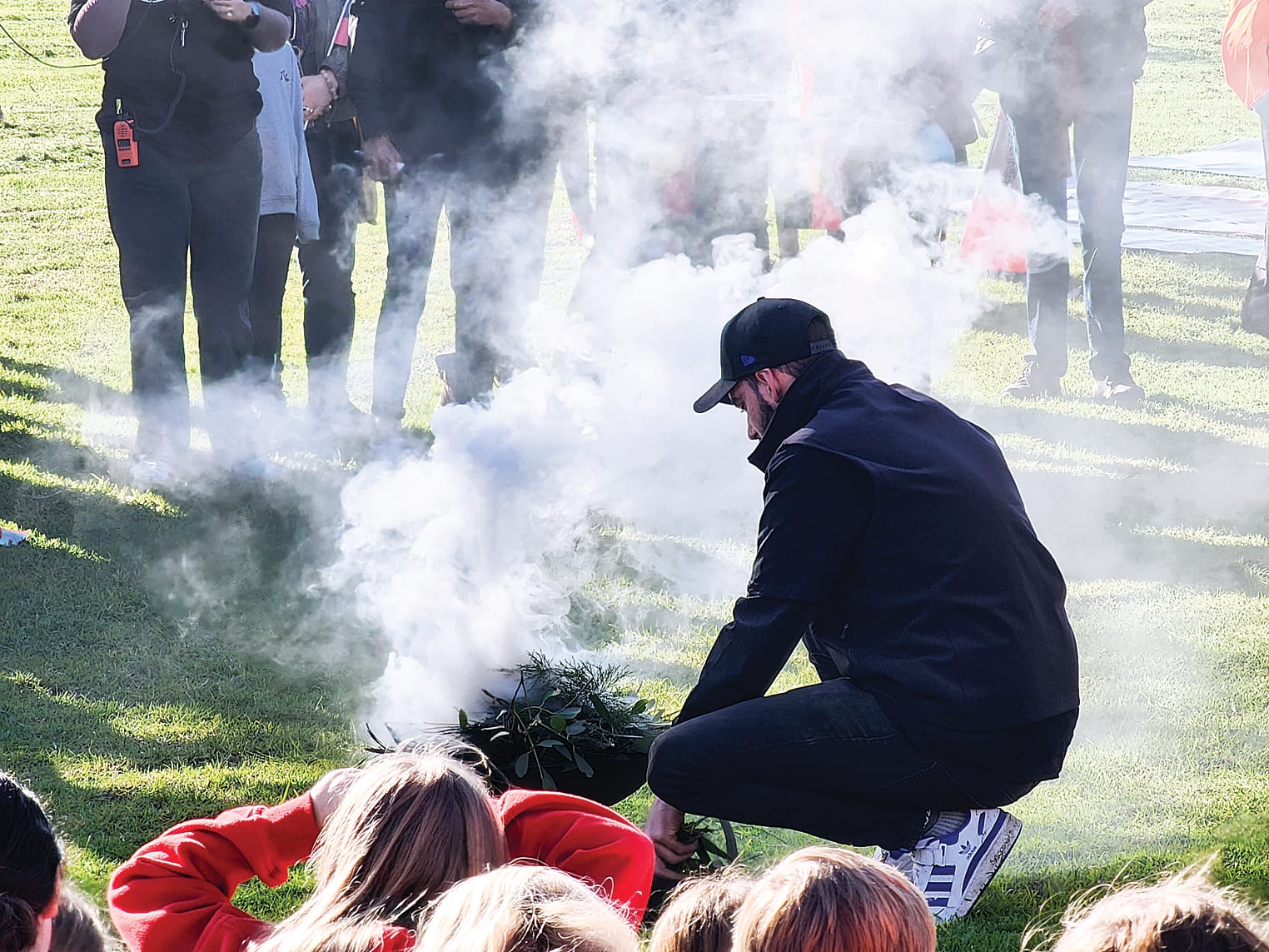 Daniel Hume from the Bunurong Land Council set a smoking site that individuals gathered around during Aunty Sonia Weston-Hume’s Welcome to Country. Individuals were invited to walk through the smoke to cleanse their bodies and feet before joining the Bridge Walk. C33_2922