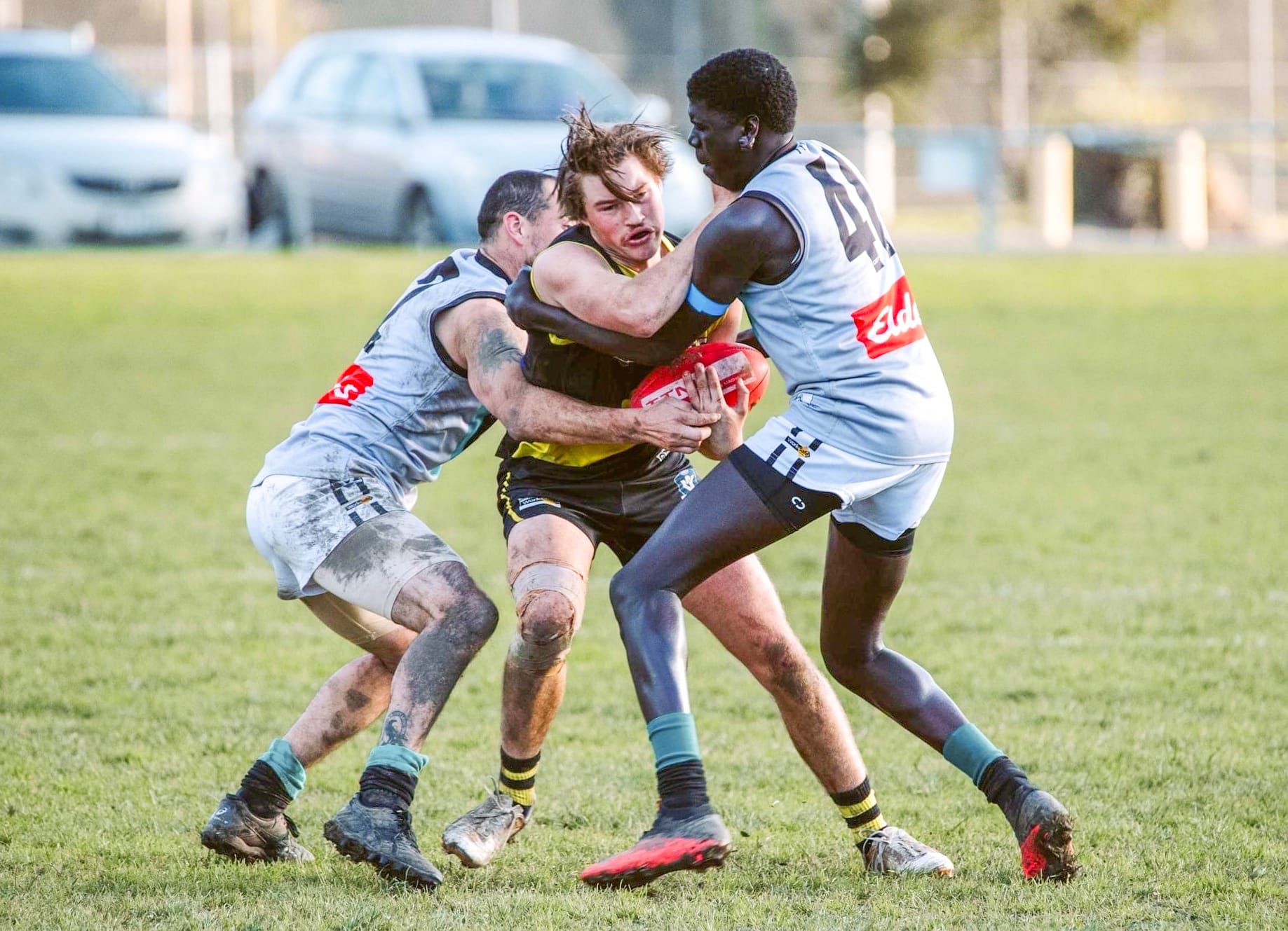 Mirboo North’s Rhys Kratzat wrestles against his Toora opponents. Photo: Annie Holland