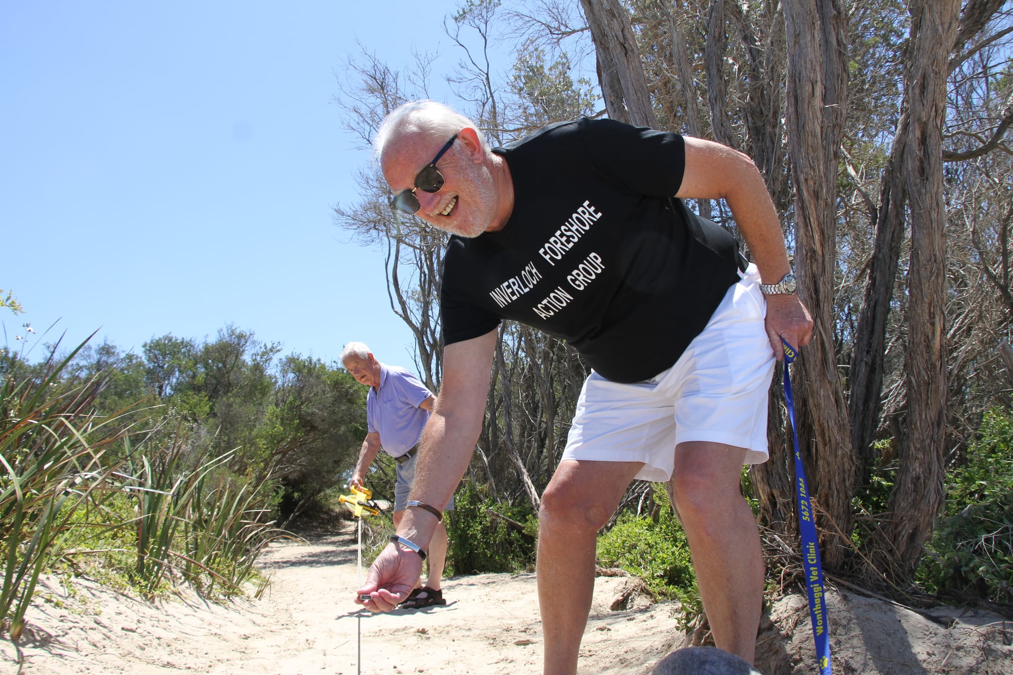 Keith Godridge former Woorayl Shire Engineer and Paul Cross from the Inverloch Foreshore Action Group measuring Access Track 7 on Surf Parade Inverloch during summer showing how much sand has been lost in just six months. B27_5224