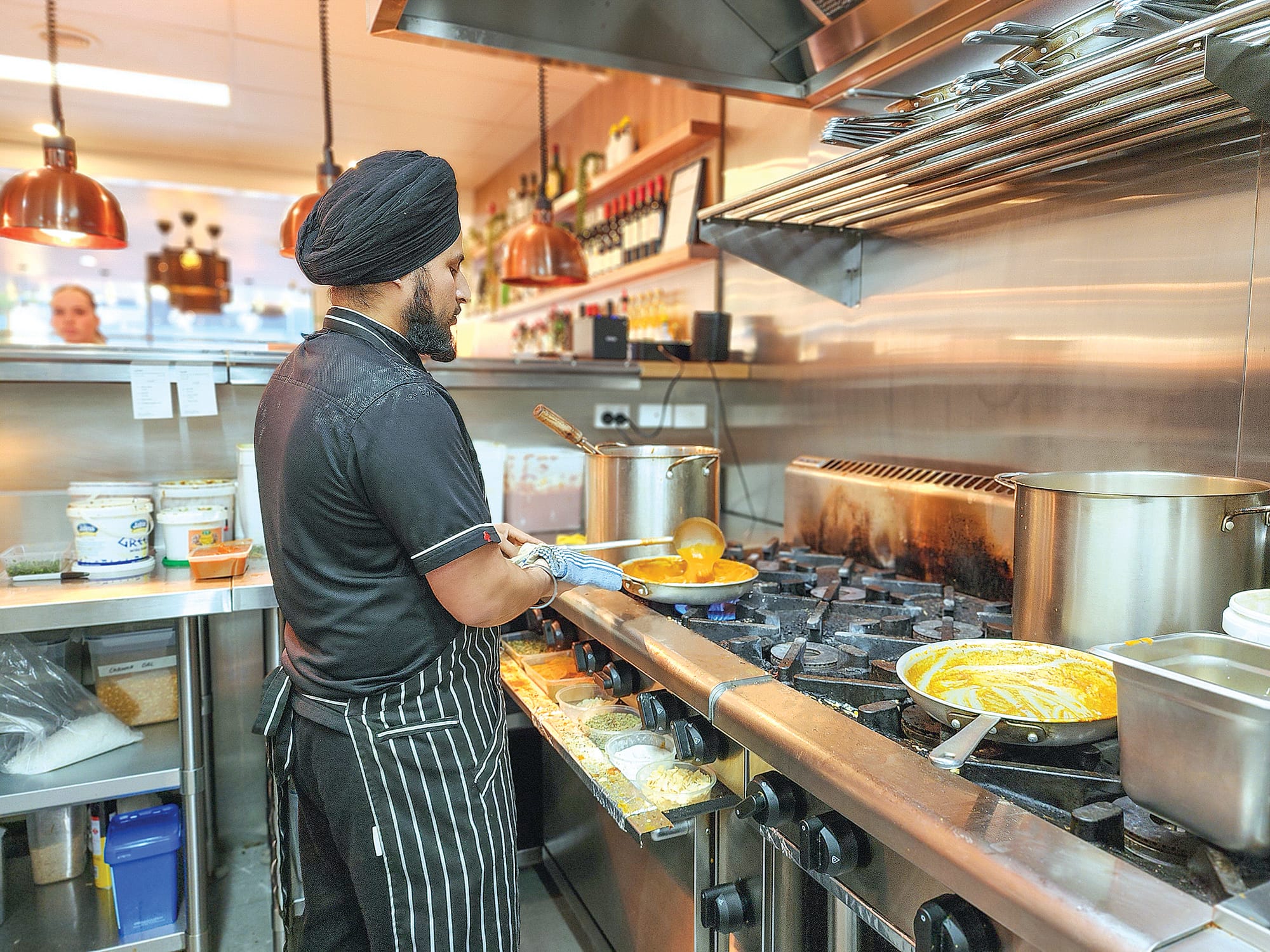 Teji cooking up a delicious curry in the kitchen on Sunday. C02_3025