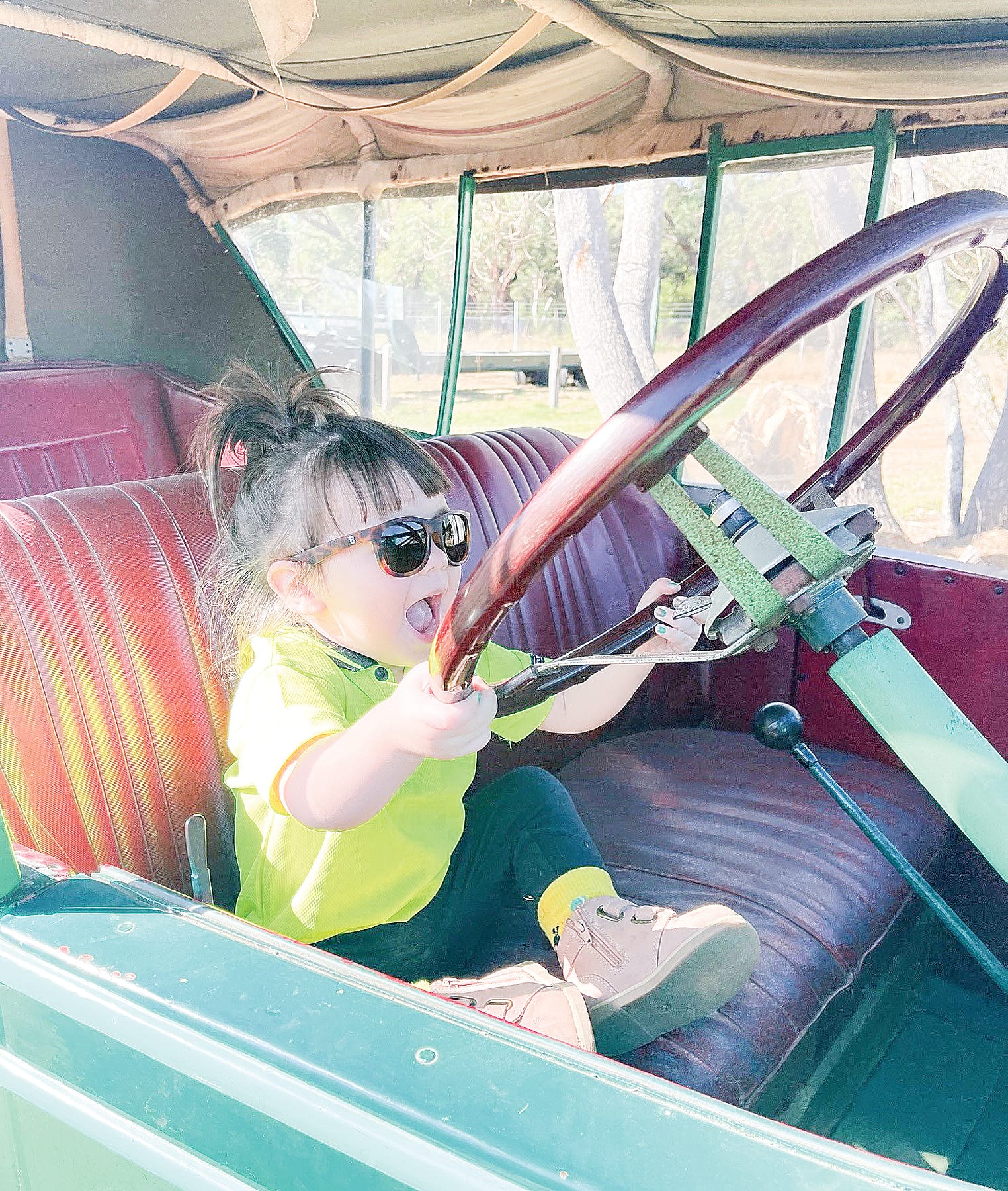 A very excited two-year-old Ella Wylie in a 1927 Chevrolet Tourer restored by her great grandfather.