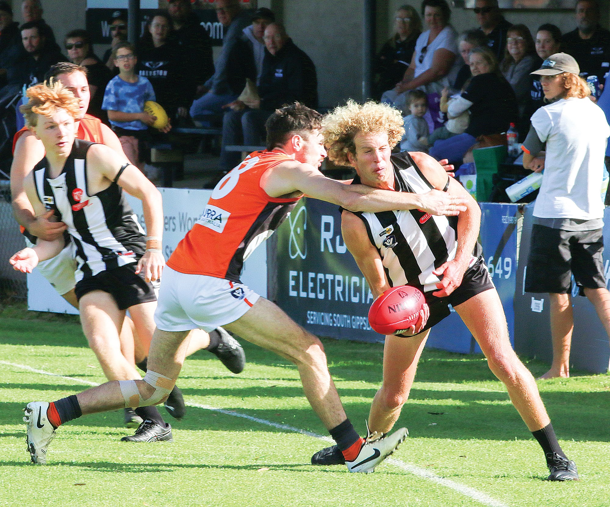 A tackle by Giants Lachlan Smith brought Brad Monson to his knees in the first quarter. C84_1824