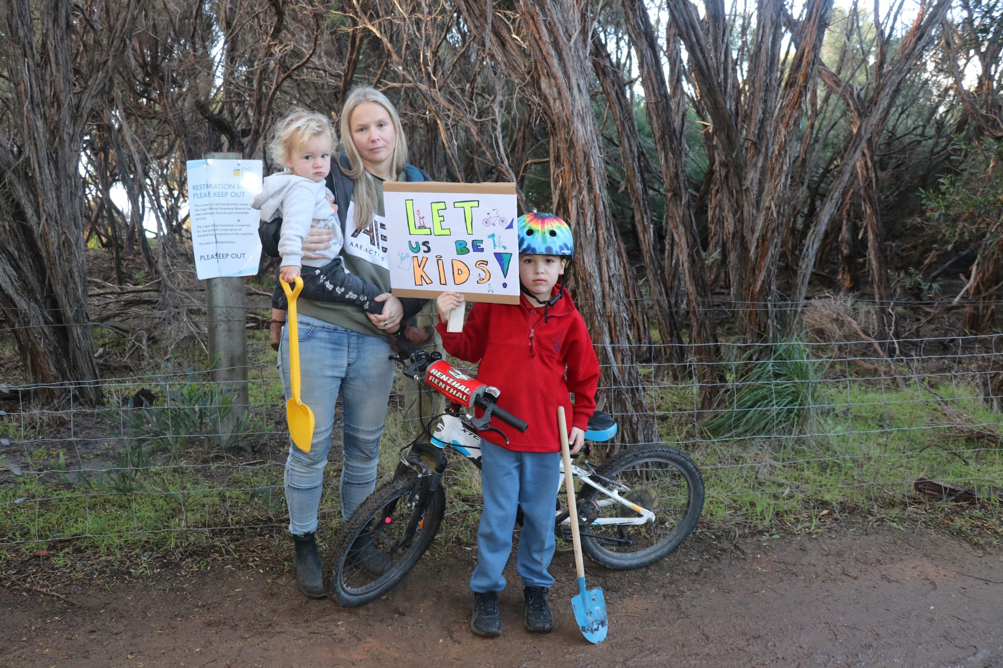 Melissa Drager and her children Cody and Tyler pictured at the Cape Woolamai foreshore bike track after council fenced it off and declared it ‘illegal’