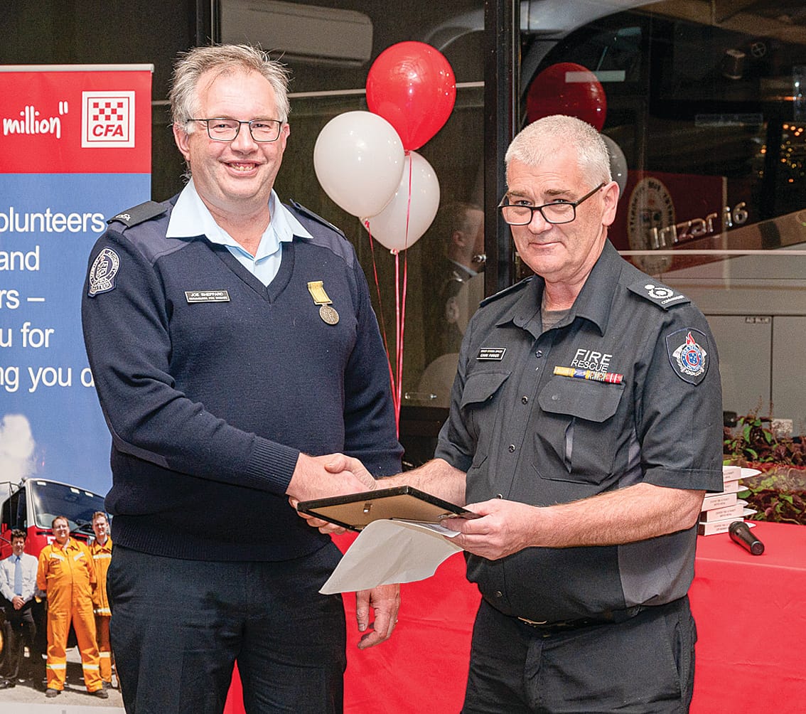 CFA Catchment Commander Gavin Parker presenting a five-year service award to Joe Sheppard.